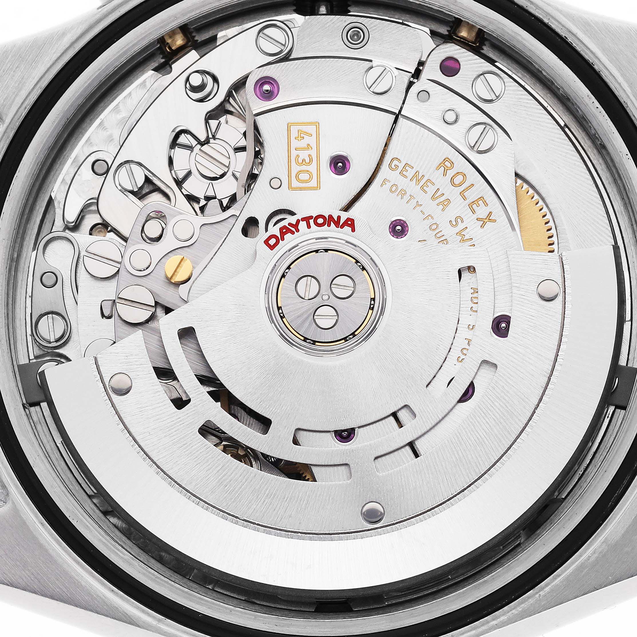 The image shows the movement of a Rolex Daytona 116523 Men's Steel and Gold (two tone) Grey Dial 116523 Men's Steel and Gold (two tone) Grey Dial watch with visible gears and the rotor.
