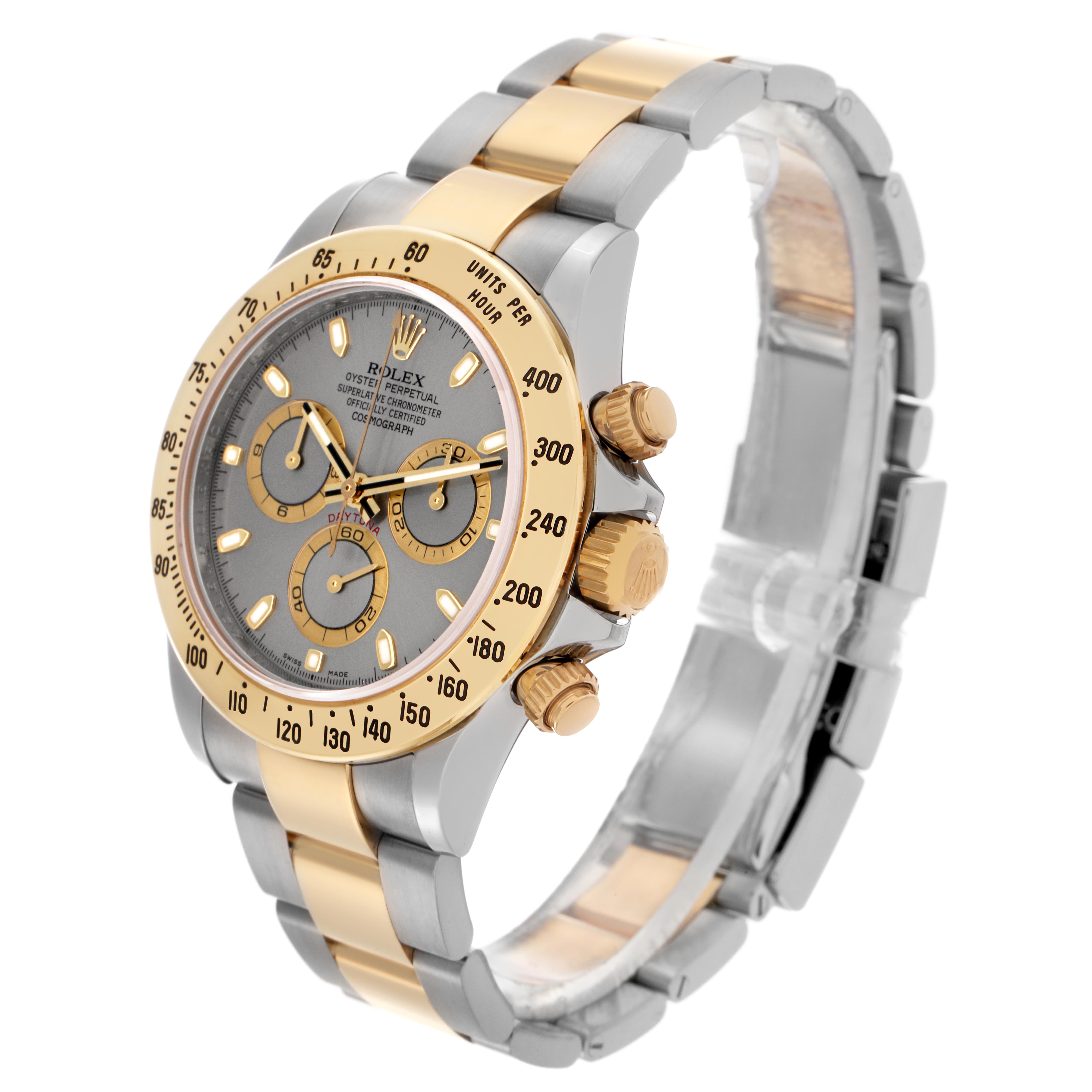 This image shows a Rolex Daytona 116523 Men's Steel and Gold (two tone) Grey Dial 116523 Men's Steel and Gold (two tone) Grey Dial watch at a 3/4 angle, highlighting the face, bezel, and two-tone bracelet.