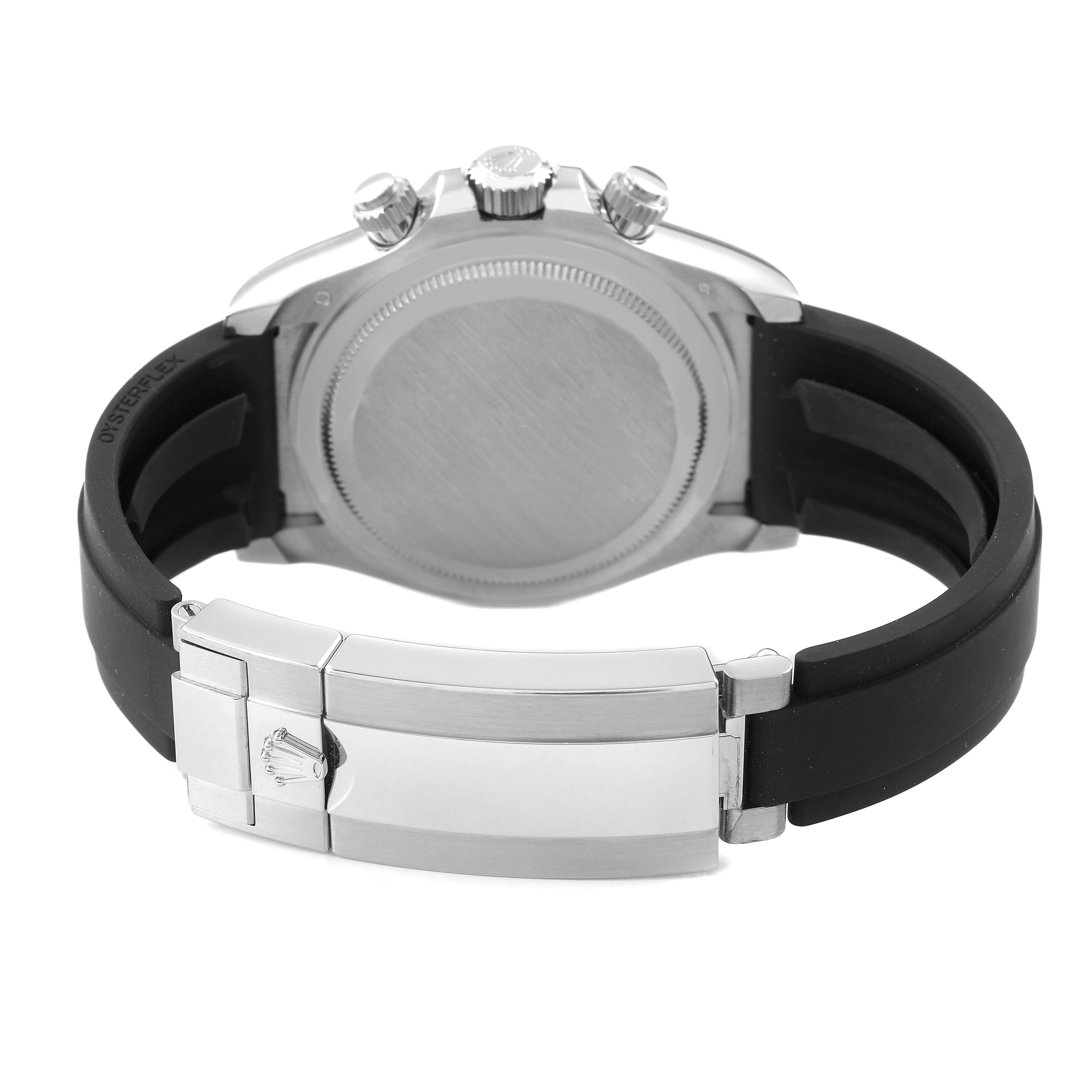 The image shows the back view of a Rolex Daytona 126519 Men's White Gold Black Dial, highlighting the case back, crown, pushers, and clasp of the rubber strap.