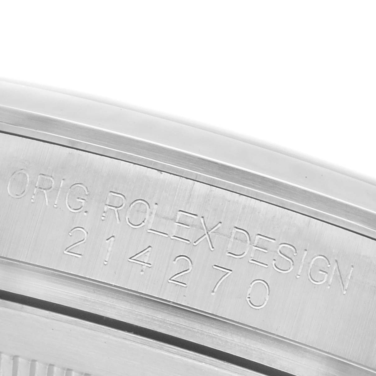 The image shows the engraved side of the bezel from a Rolex Explorer 214270 Men's Stainless Steel Black Dial 214270 Men's Stainless Steel Black Dial watch.