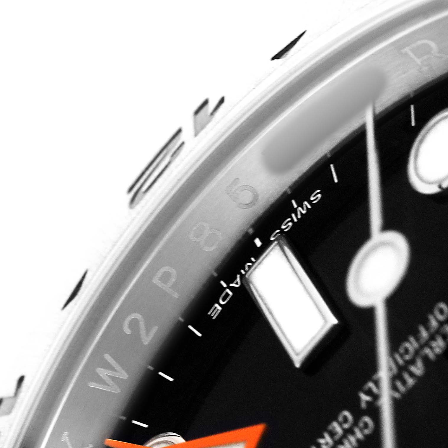The image shows a close-up of the Rolex Explorer 216570 Men's Stainless Steel Black Dial watch face, focusing on the dial and markers at an angled view.