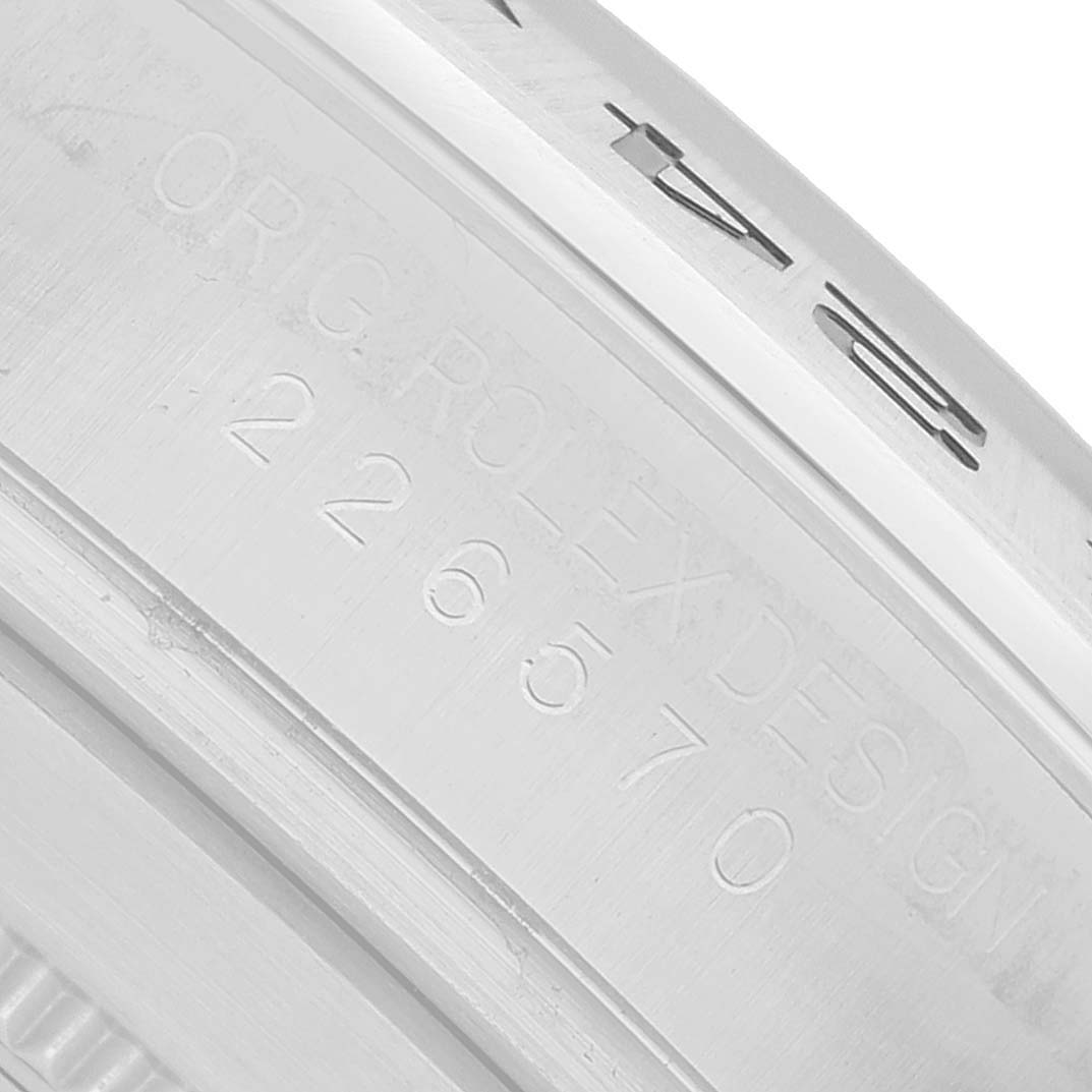 The image shows the side engraving of a Rolex Explorer 226570 Men's Stainless Steel Black Dial watch, featuring "ROLEX DESIGN" and the model number.