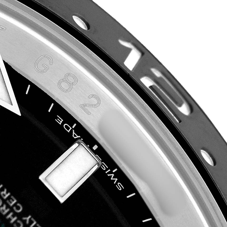 The close-up image shows part of the bezel, dial, and an hour marker of the Rolex GMT-Master 116710 Men's Stainless Steel Black Dial watch.