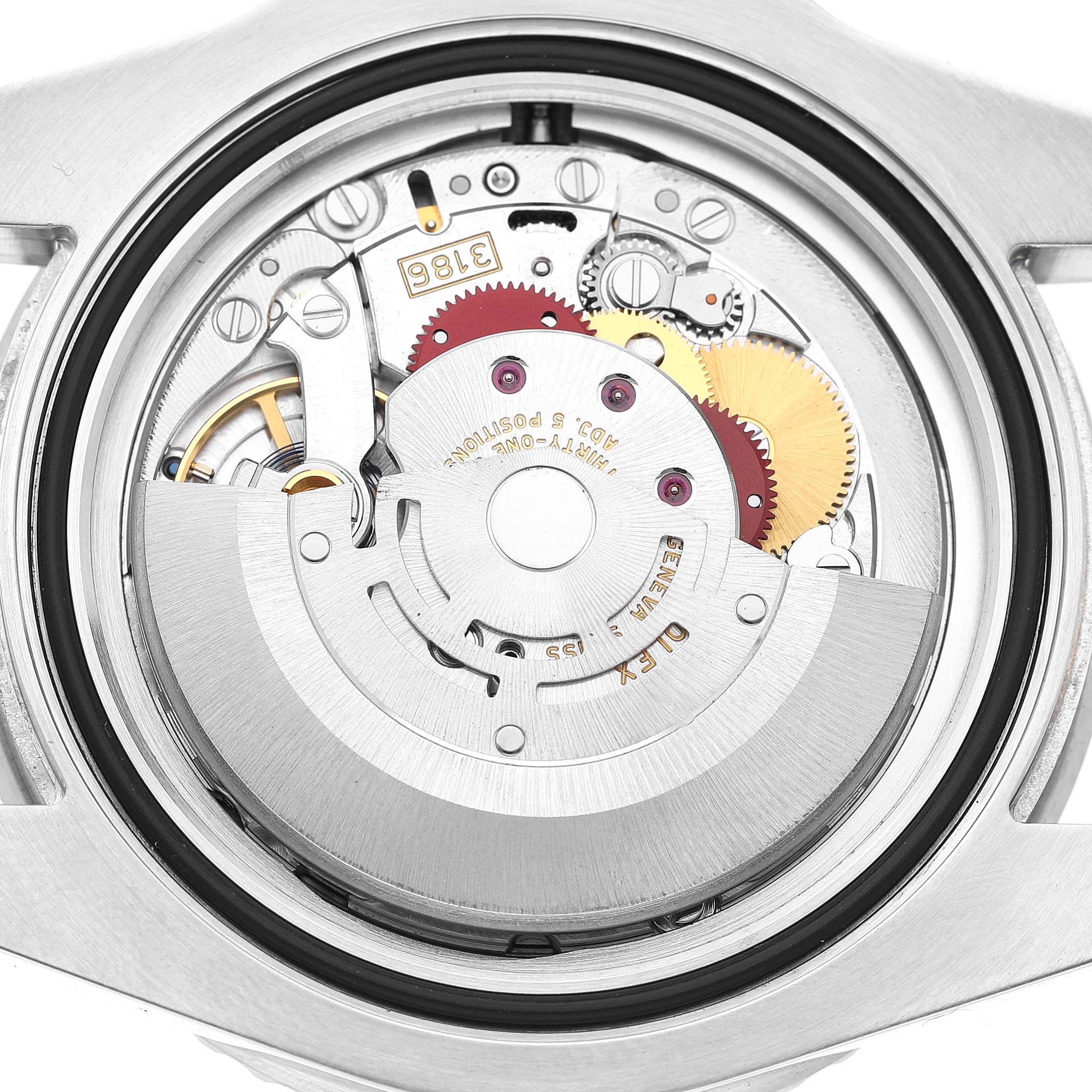 The image shows the movement mechanism of a Rolex GMT-Master 116710 Men's Stainless Steel Black Dial watch from a rear angle, highlighting gears and the rotor.