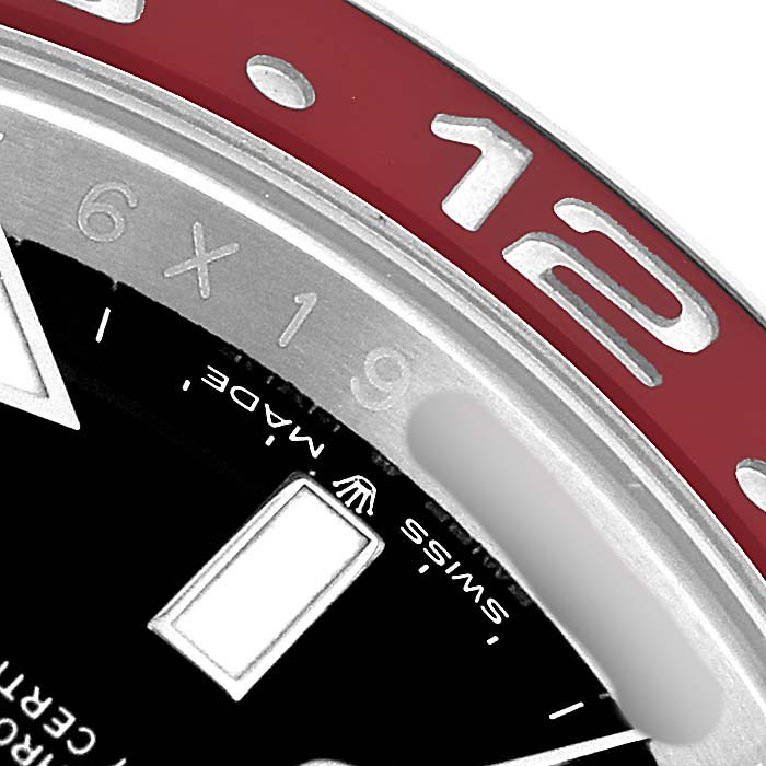 The image shows a close-up of the Rolex GMT-Master 126710 Men's Stainless Steel Black Dial bezel and part of the dial, highlighting the red and silver accents.