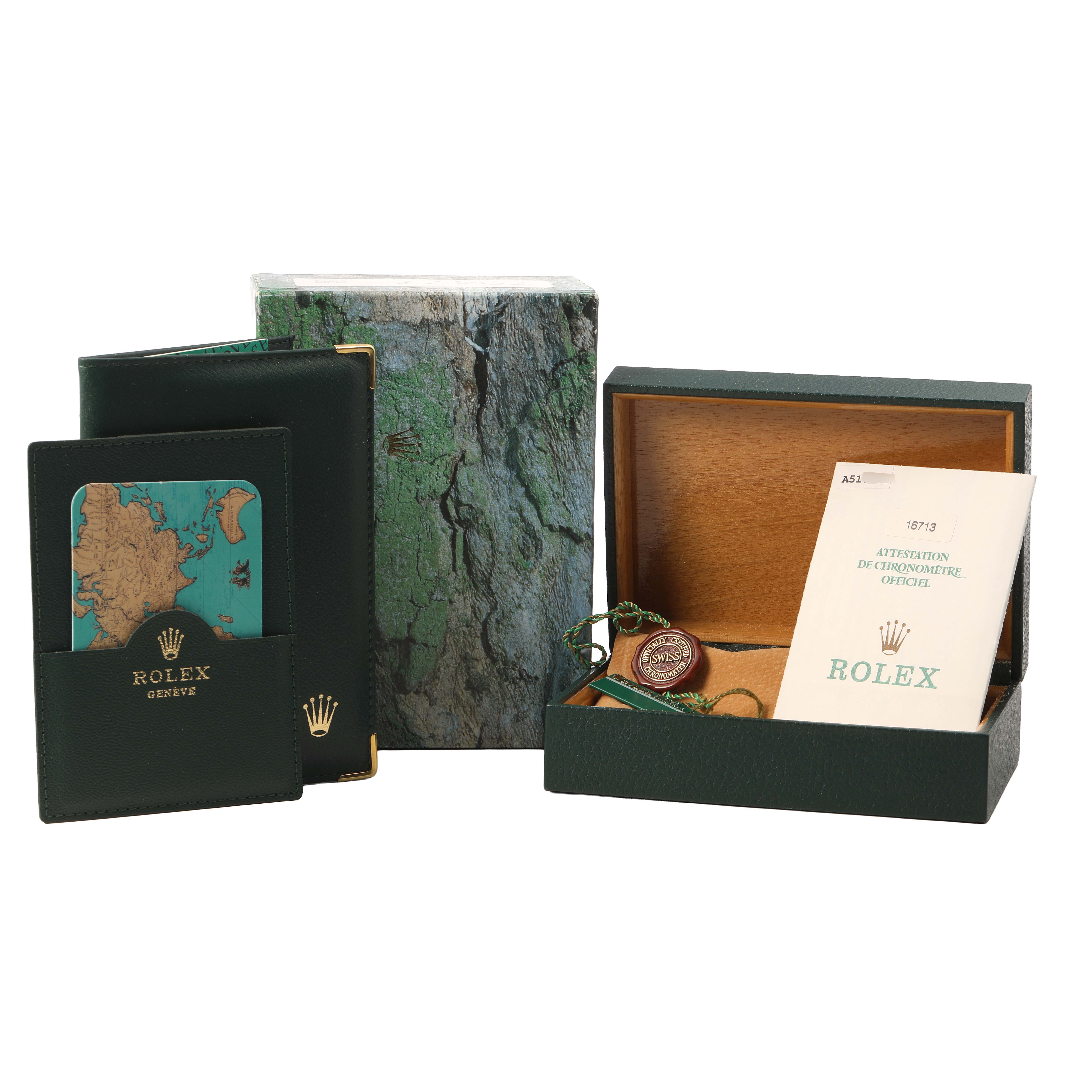 The image shows packaging and accessories for a Rolex GMT-Master 16713LN Men's Steel and Gold (two tone) Black Dial, including the box, papers, and tags.