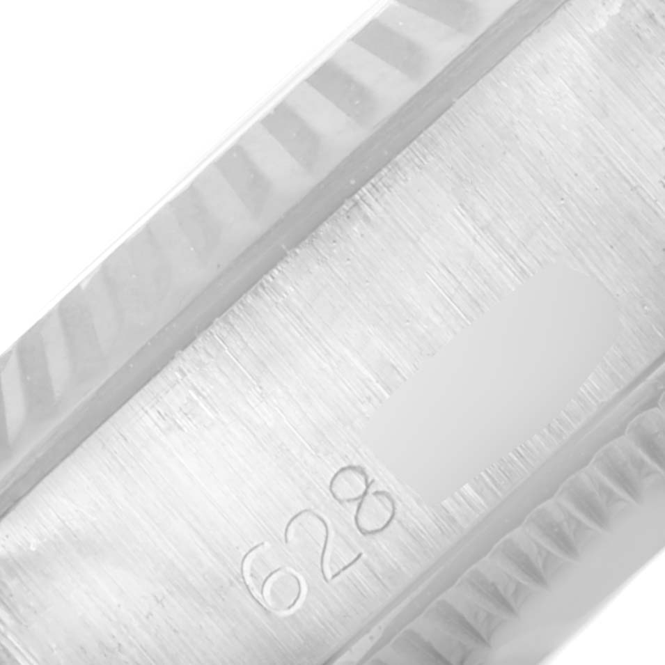 This close-up image shows the side engraving details of an Oyster Perpetual Rolex watch.