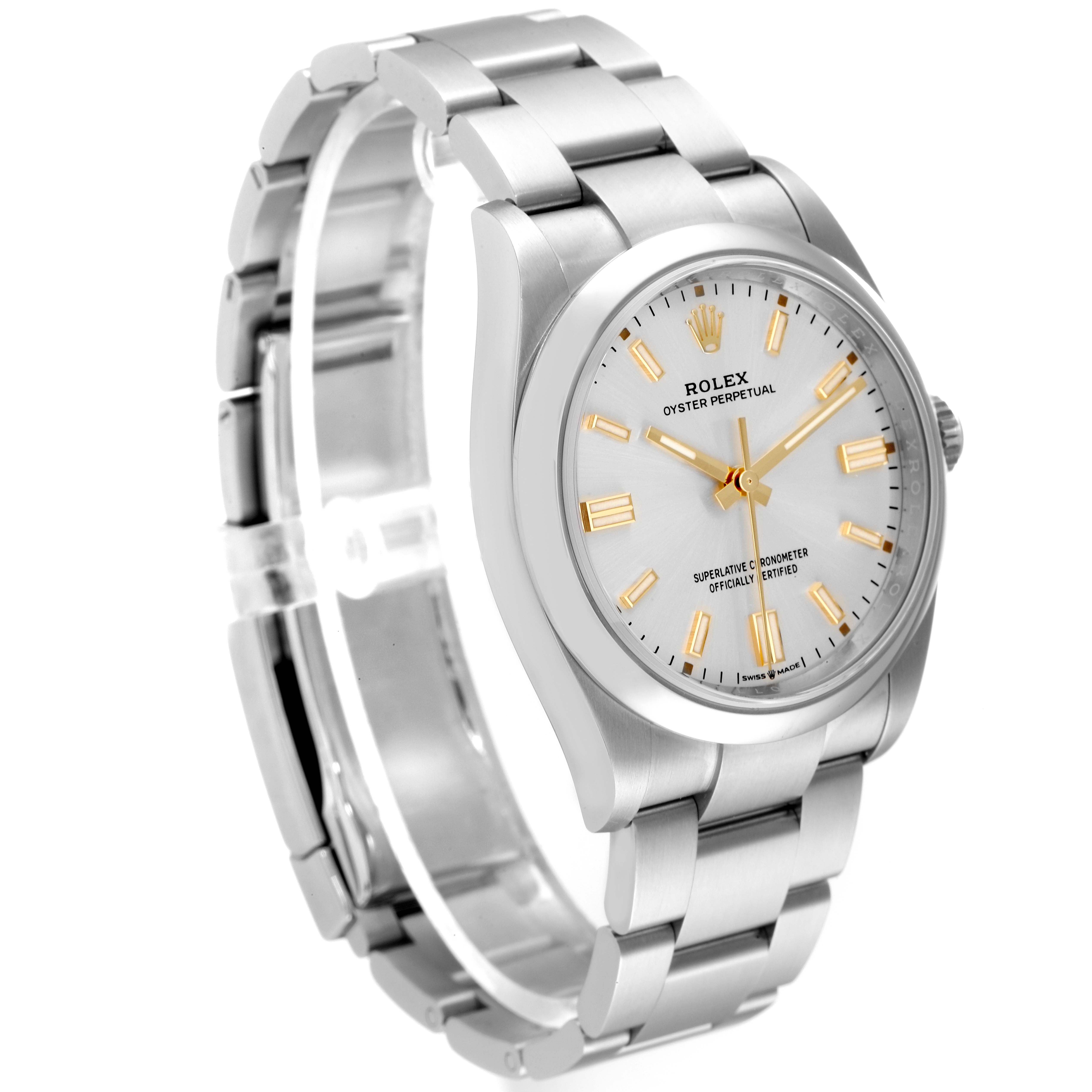 This image shows a Rolex Oyster Perpetual 126000 Men
s Stainless Steel Silver Dial 126000 Men
s Stainless Steel Silver Dial watch angled to display its silver bracelet, white dial, and gold hour markers.
