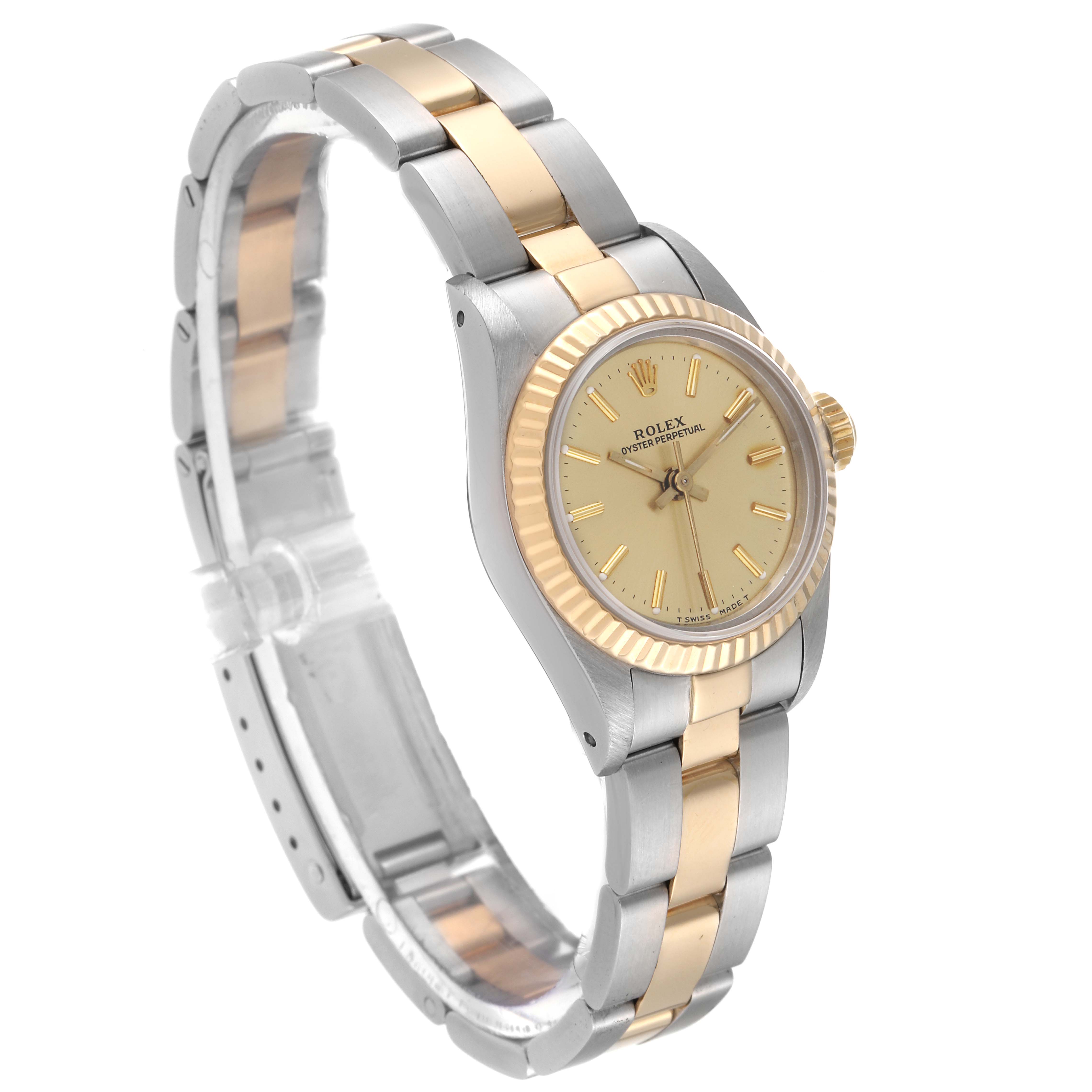 The image shows an angled side view of a Rolex Oyster Perpetual 67193 Women's Steel and Gold (two tone) Champagne Dial 67193 Women's Steel and Gold (two tone) Champagne Dial watch, highlighting its two-tone band, bezel, and face.