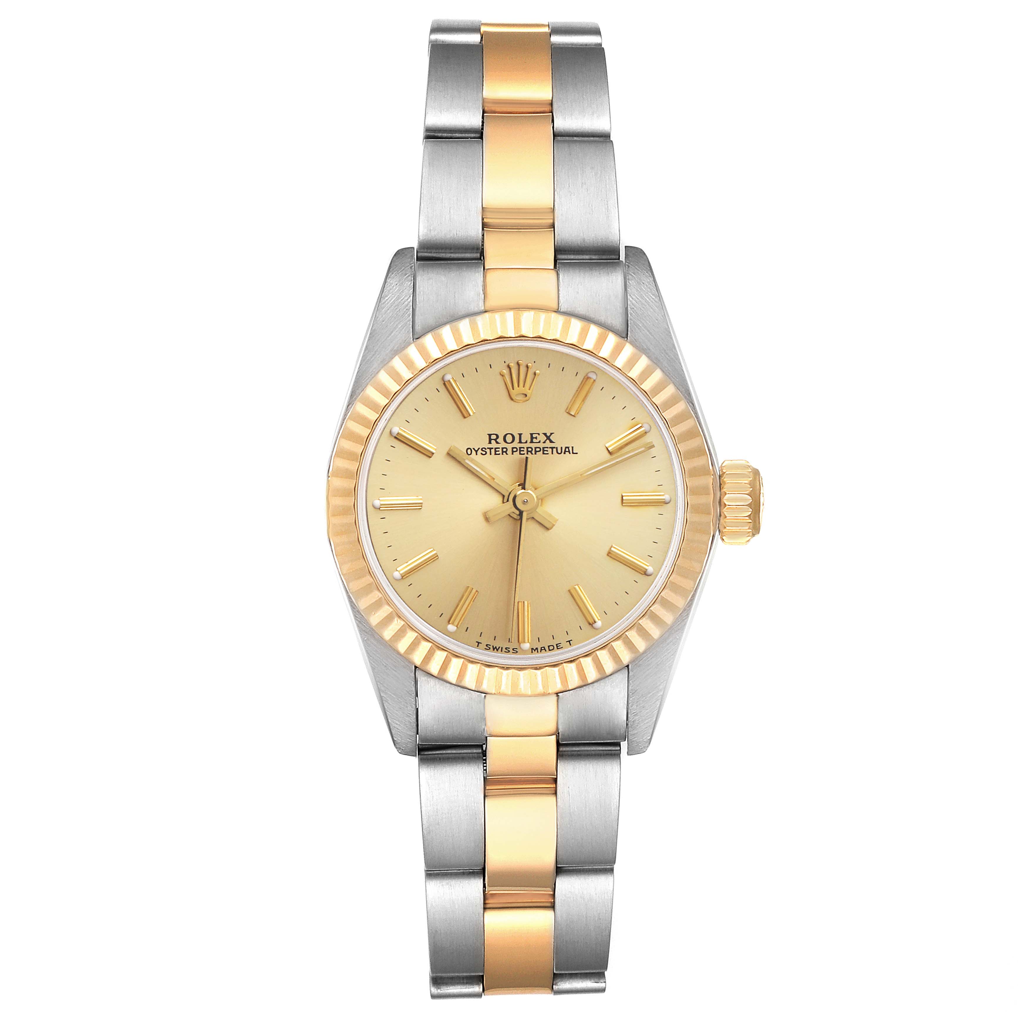 The Rolex Oyster Perpetual 67193 Women's Steel and Gold (two tone) Champagne Dial 67193 Women's Steel and Gold (two tone) Champagne Dial watch is shown from a top-down angle, displaying its two-tone metal bracelet and gold face.