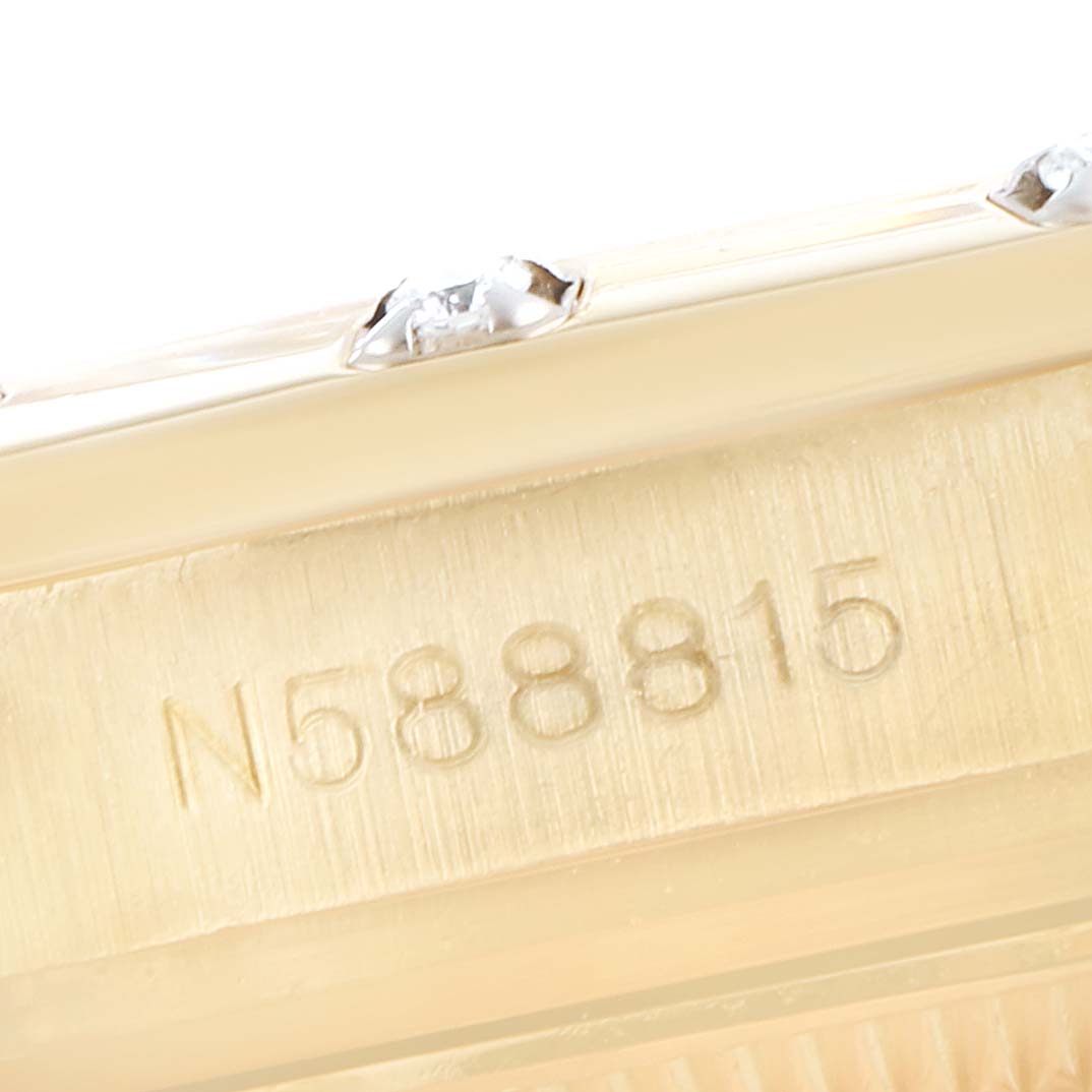 This close-up of the Rolex Pearlmaster 69318 Women
s Yellow Gold White Dial 69318 Women
s Yellow Gold White Dial watch shows the serial number engraved on the case.