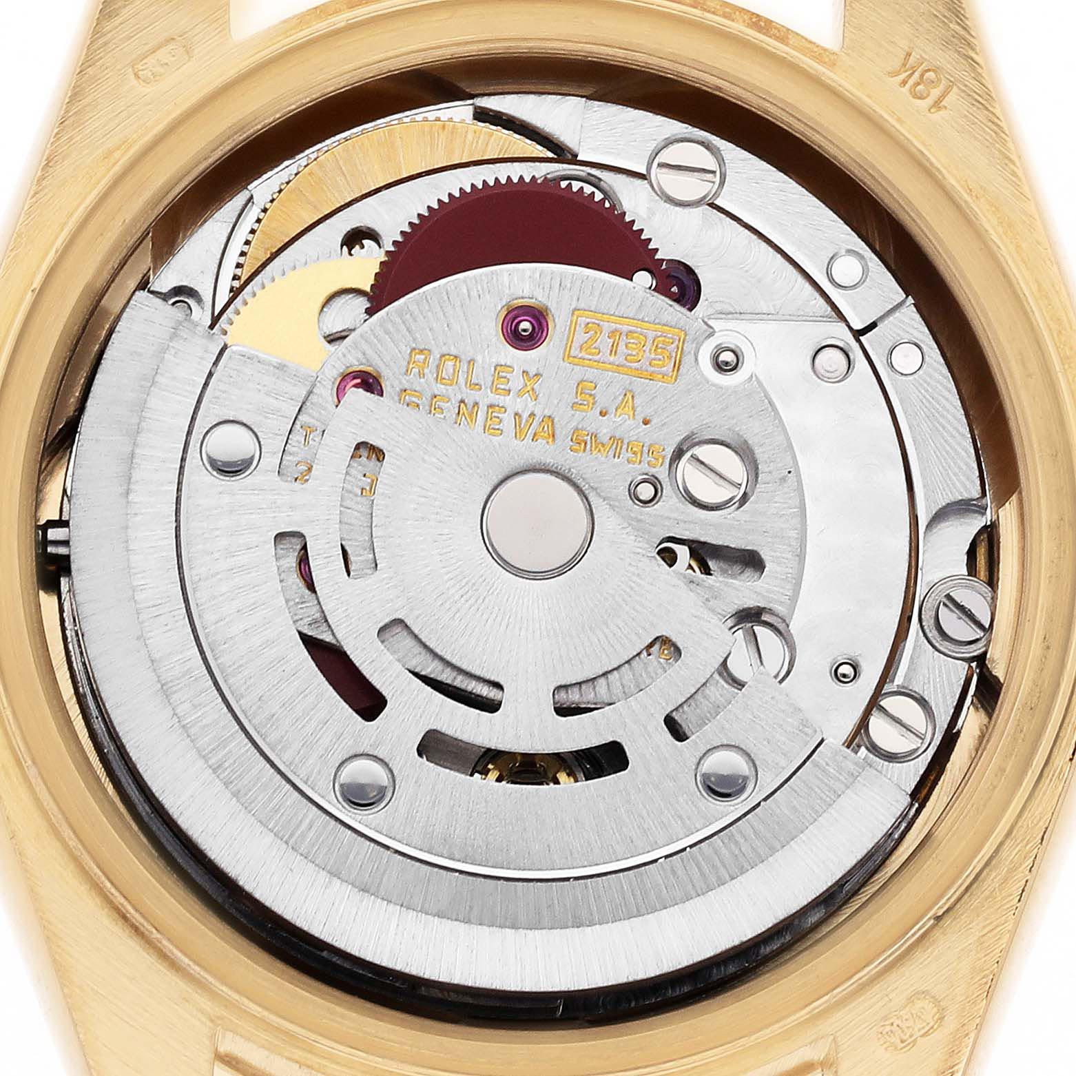 The image shows a close-up of the movement inside the Rolex President 69178 Women's Yellow Gold Champagne Dial 69178 Women's Yellow Gold Champagne Dial model, highlighting its intricate internal components.