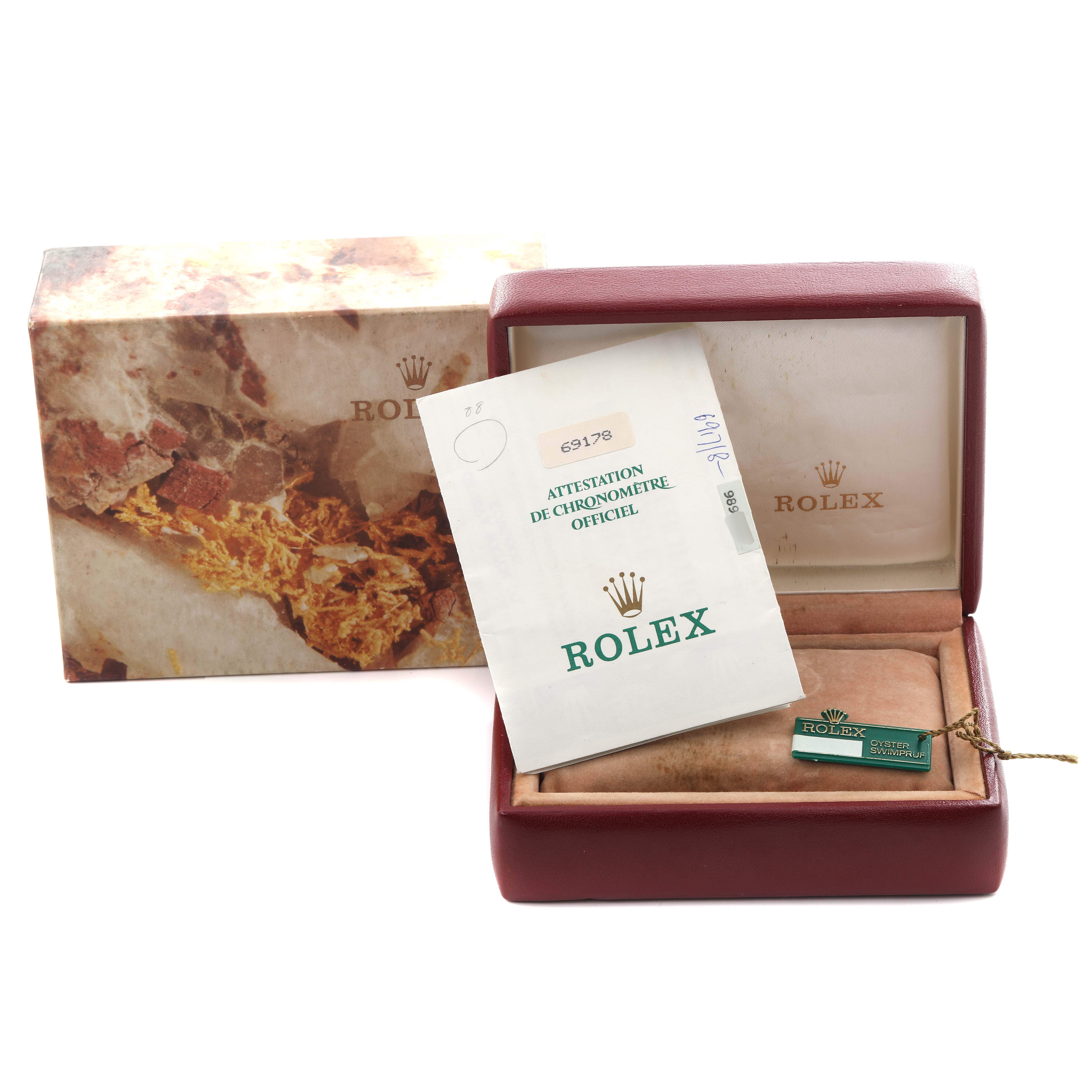 The image shows a Rolex President 69178 Women's Yellow Gold Champagne Dial 69178 Women's Yellow Gold Champagne Dial model watch box with its outer packaging, certificate, and tag, viewed from the front angle.