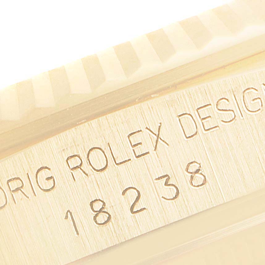 The image shows a close-up of the case side and bezel of the Rolex President 18238 Men
s Yellow Gold Black Dial 18238 Men
s Yellow Gold Black Dial model, highlighting the engraved model number 18238.