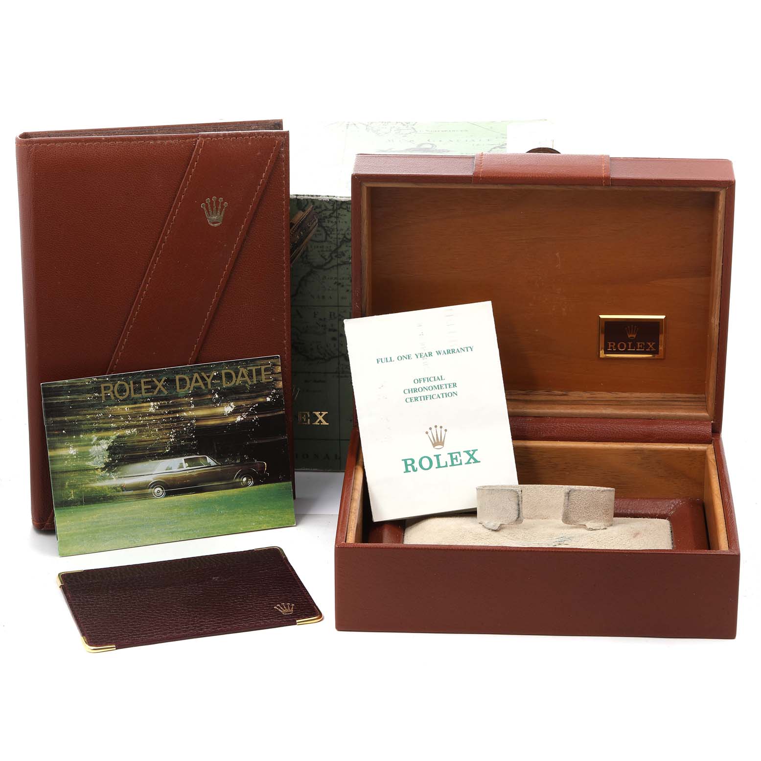 This image shows the packaging, manual, warranty card, and official papers for a Rolex President 18238 Men
s Yellow Gold Black Dial 18238 Men
s Yellow Gold Black Dial model watch.