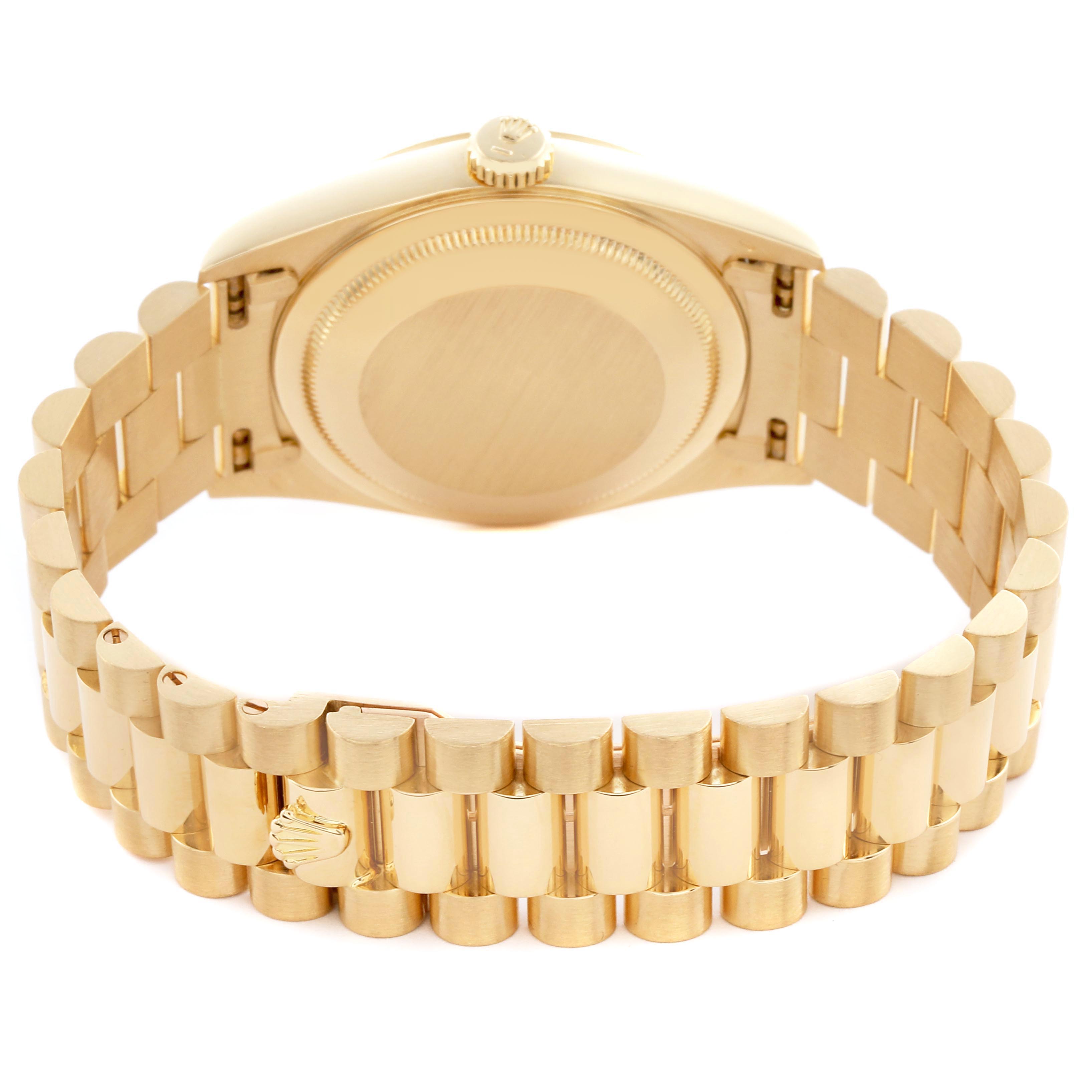 The Rolex President 18238 Men
s Yellow Gold Champagne Dial 18238 Men
s Yellow Gold Champagne Dial model watch is shown from the back, highlighting the bracelet, clasp, and case back.