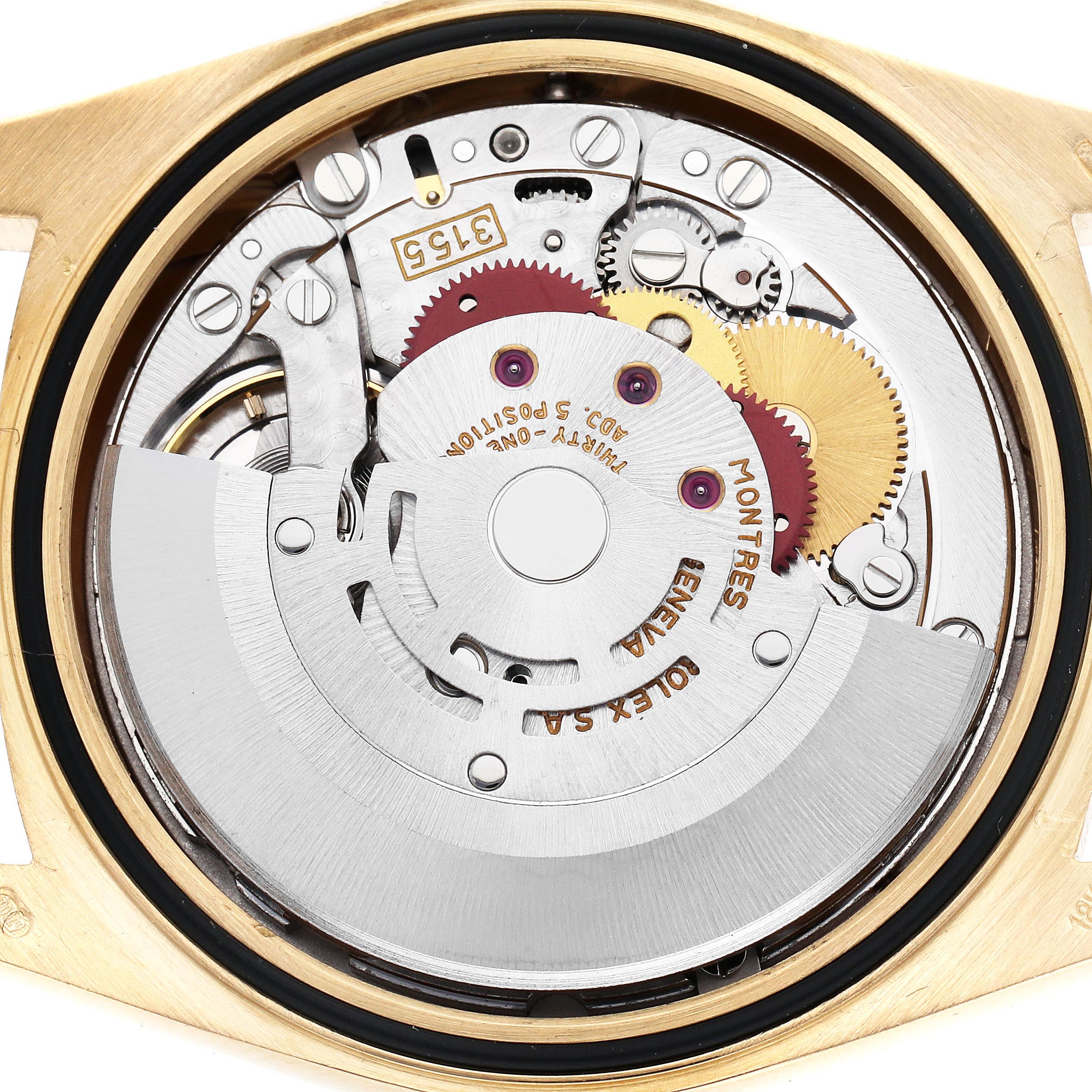 The image shows the movement mechanism of a Rolex President 18238 Men
s Yellow Gold Champagne Dial 18238 Men
s Yellow Gold Champagne Dial watch from a top-down angle, highlighting gears and components.