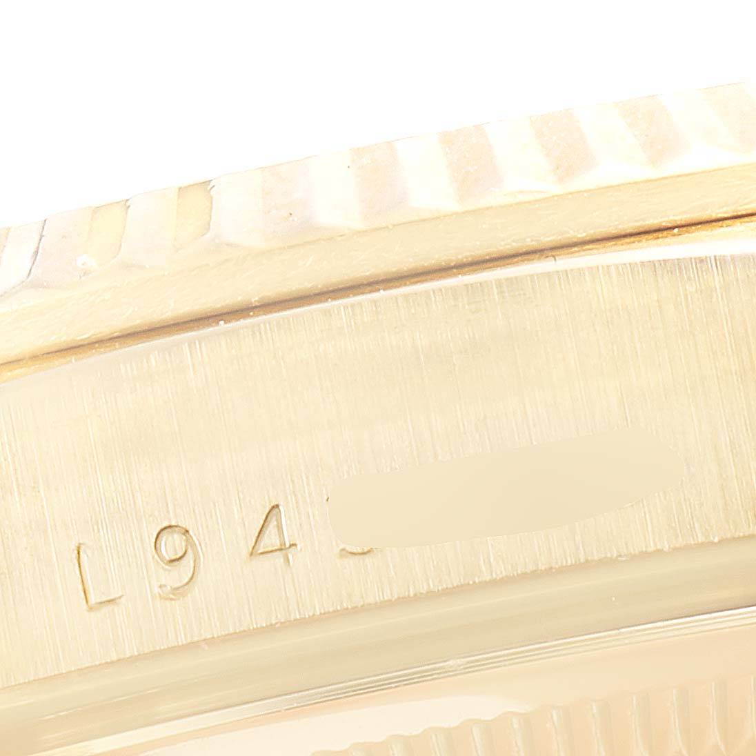 The image shows a close-up of the side case and part of the bezel of a Rolex President 18238 Men's Yellow Gold Champagne Dial 18238 Men's Yellow Gold Champagne Dial watch.