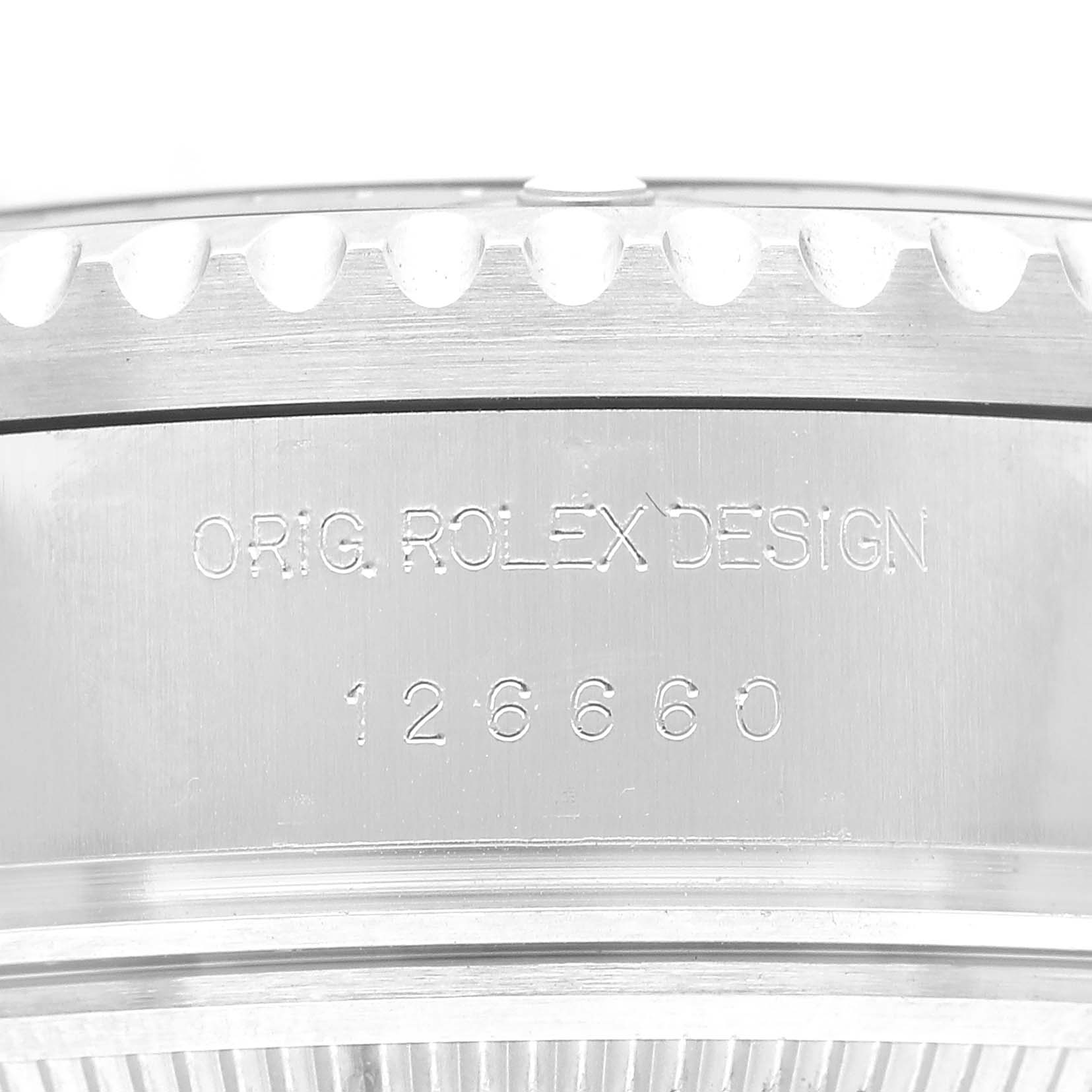 The image shows a detailed view of the engraved side of the Rolex Sea-Dweller 126660 Men's Stainless Steel Black Dial watch, focusing on the model number and branding.