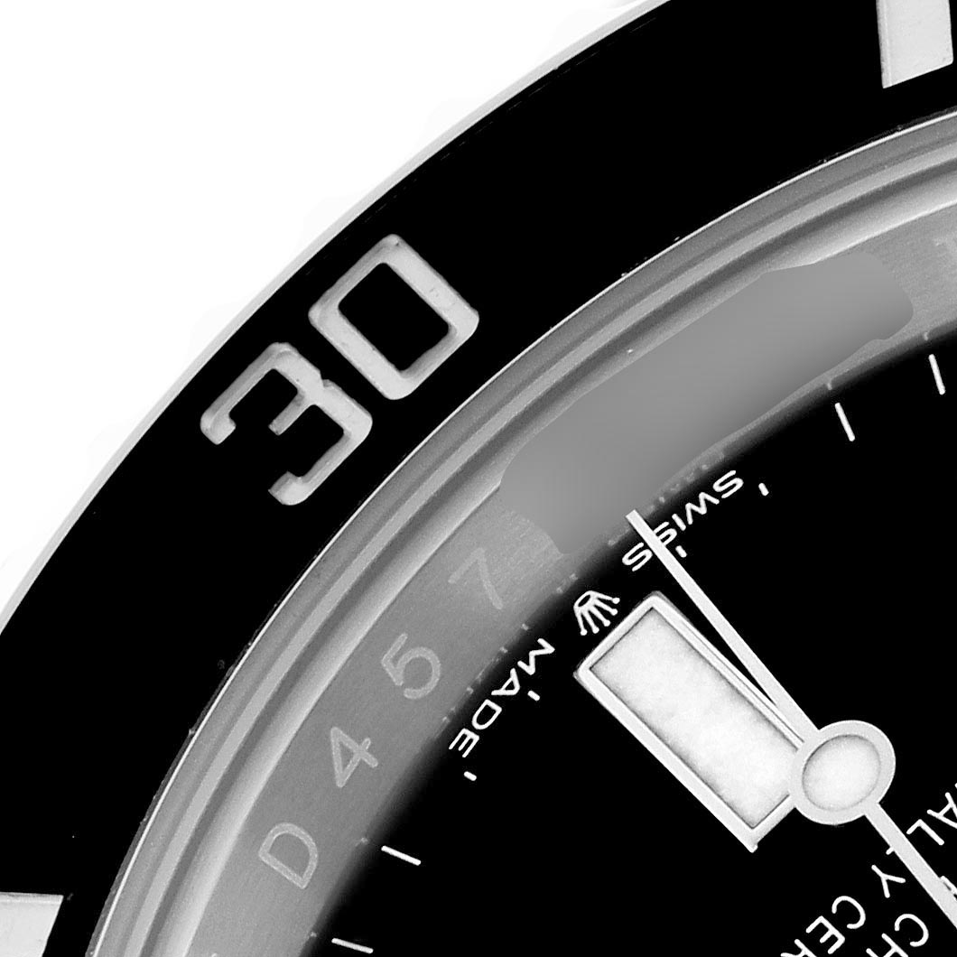 The image shows a close-up of the Rolex Submariner 126610LN Men's Stainless Steel Black Dial 126610LN Men's Stainless Steel Black Dial's dial, with part of the bezel, hour marker, and hand visible.