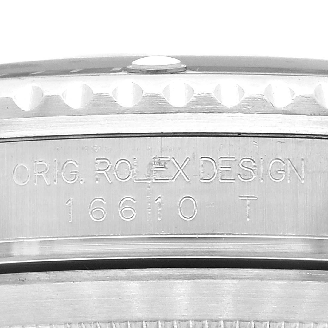 This image shows a close-up of the side of a Rolex Submariner 16610 Men's Stainless Steel Black Dial 16610 Men's Stainless Steel Black Dial watch case, featuring the engraved serial number and design details.