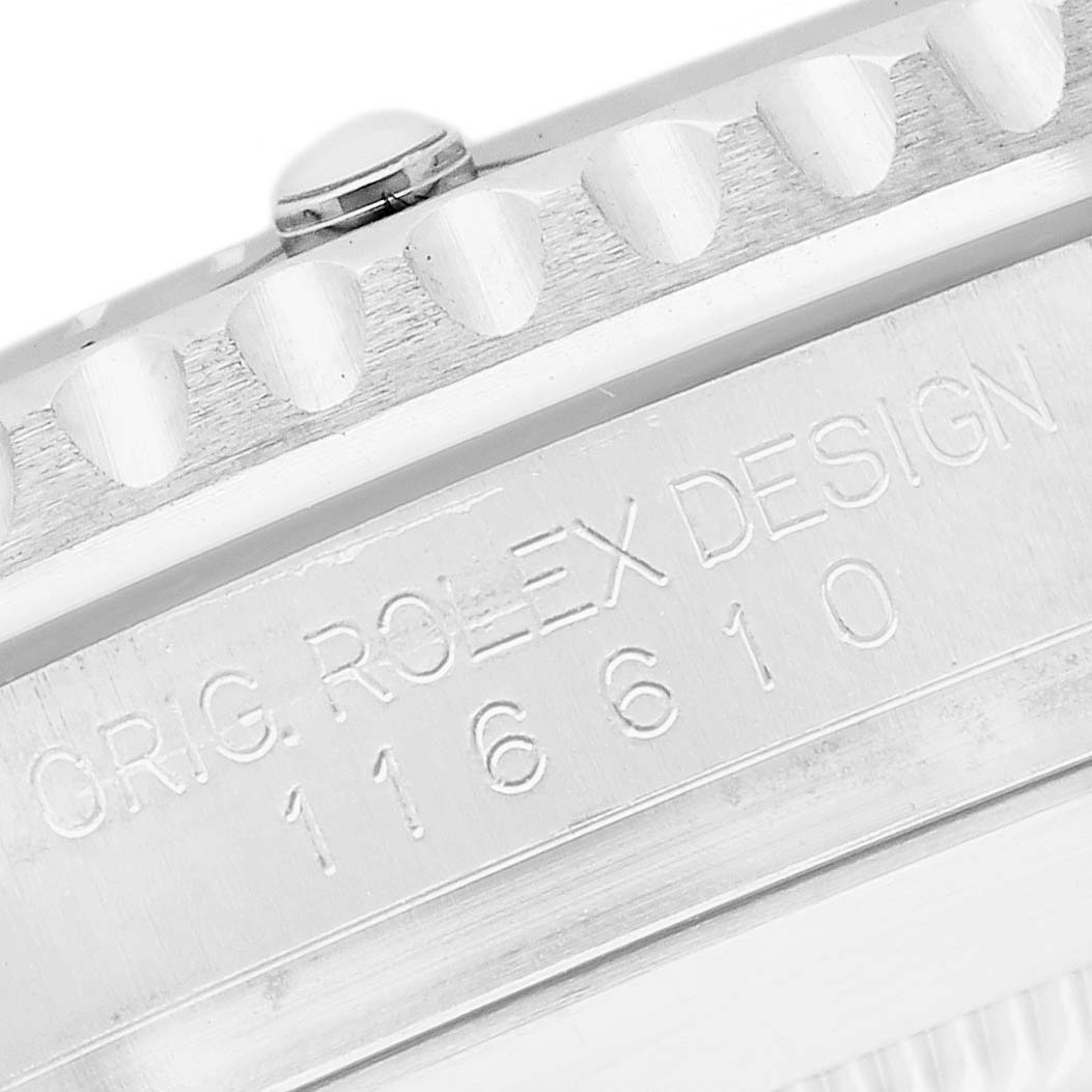 The image shows a close-up of the side of a Rolex Submariner 116610LN Men's Stainless Steel Black Dial, featuring the bezel and engraved watch case with model number.