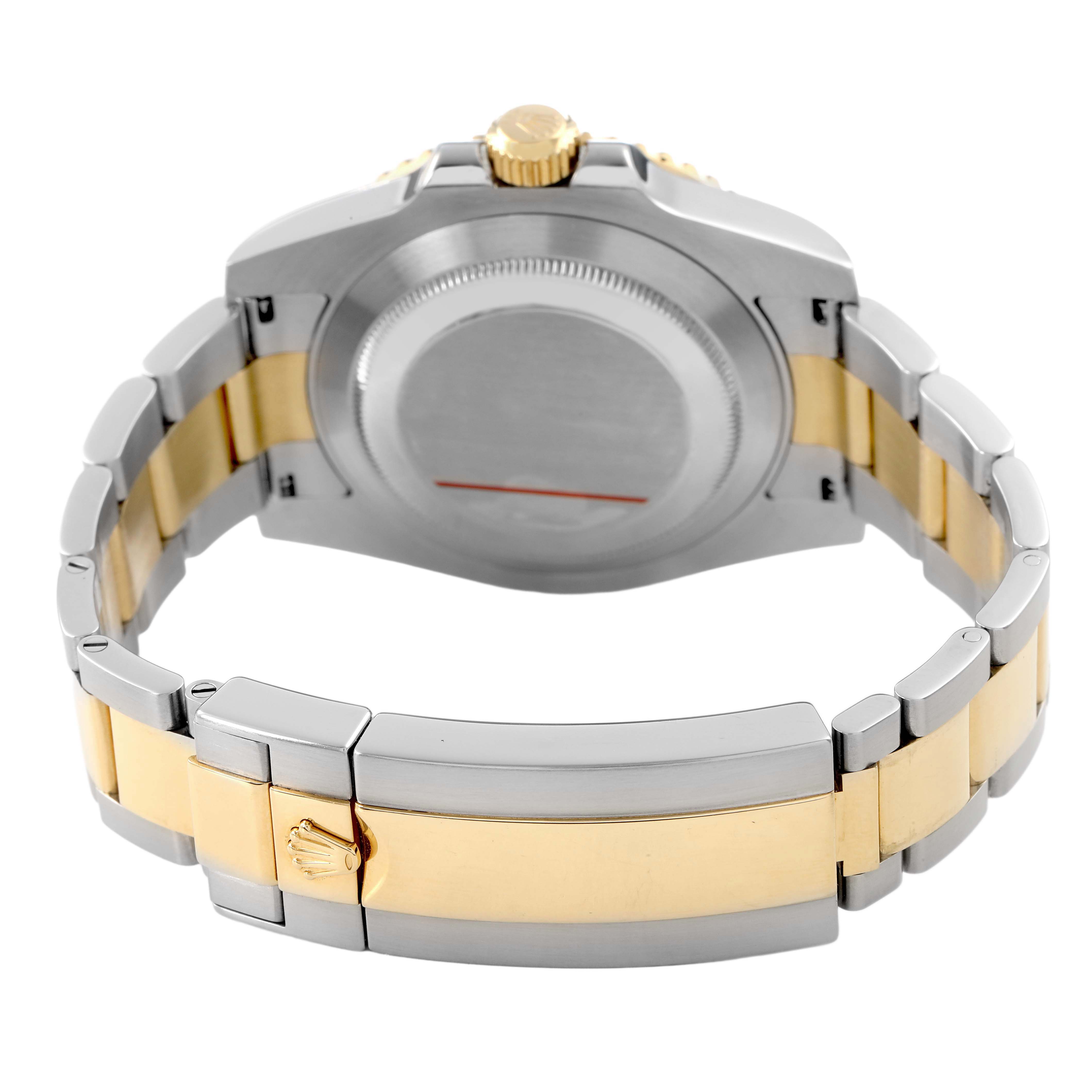 The image shows the back of a Rolex Submariner 116613 Men's Steel and Gold (two tone) Blue Dial watch, featuring its case back and two-tone bracelet clasp.