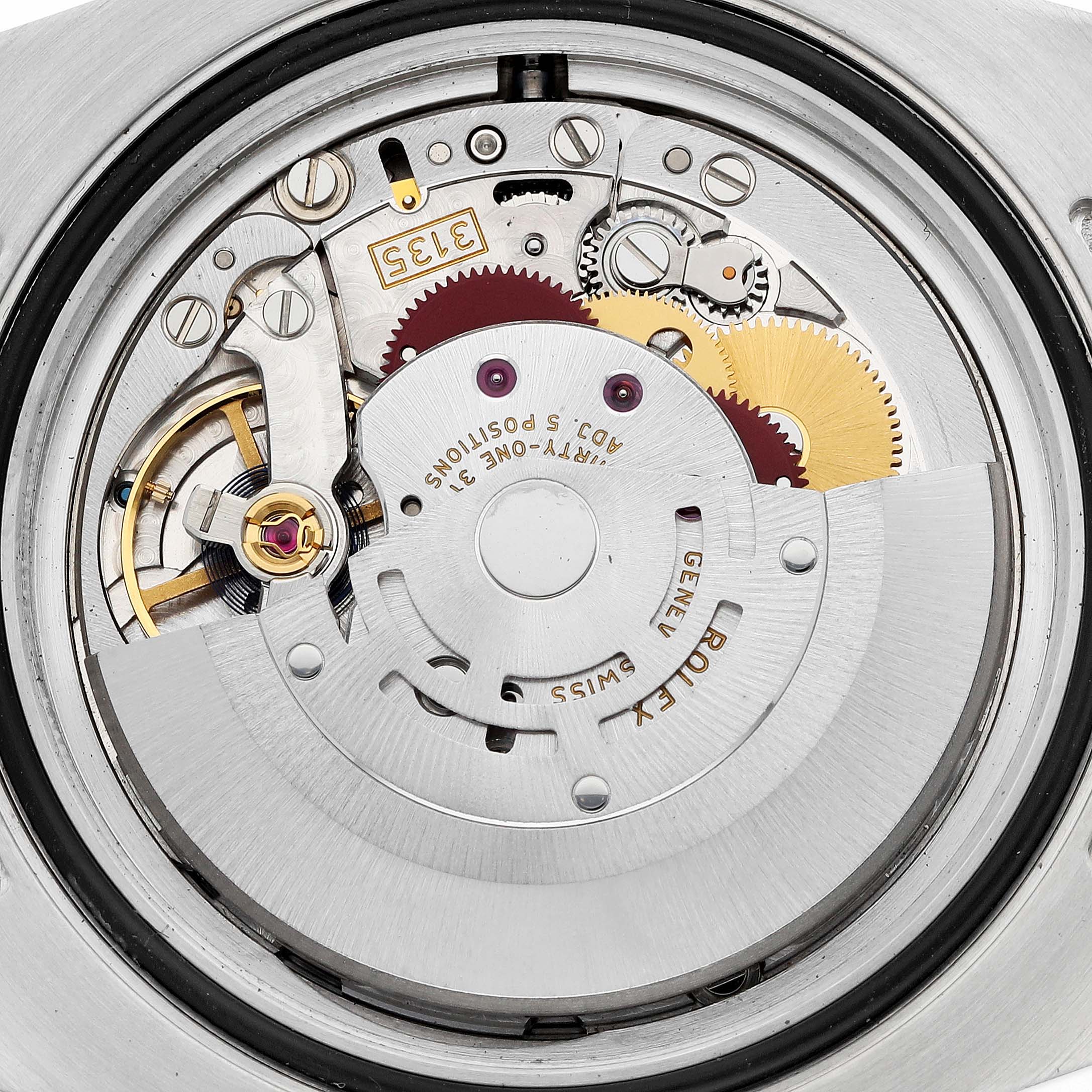 This image shows the movement and internal components of a Rolex Submariner 116613 Men's Steel and Gold (two tone) Blue Dial watch from the back.