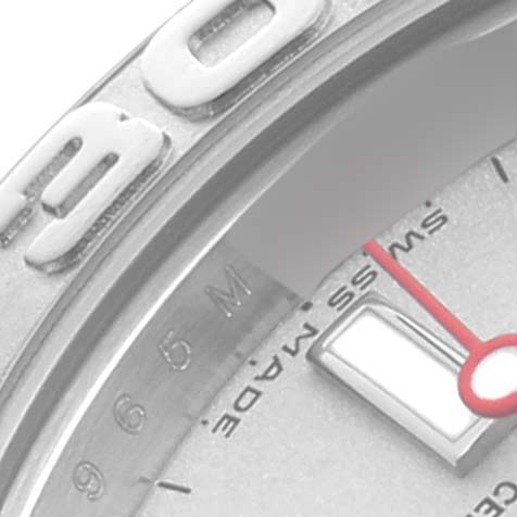 The image shows a close-up of the Rolex Yacht-Master 169622 Women
s Stainless Steel Silver Dial 169622 Women
s Stainless Steel Silver Dial watch
s bezel, part of the dial, and the tip of a hand.