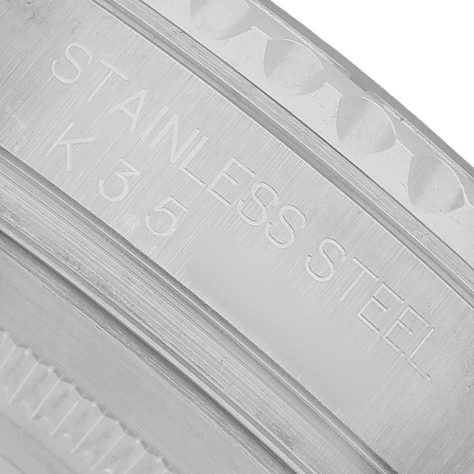 This close-up image shows the side engraving on the bezel of a Rolex Yacht-Master 16622 Men's Stainless Steel Silver Dial watch, highlighting "STAINLESS STEEL."