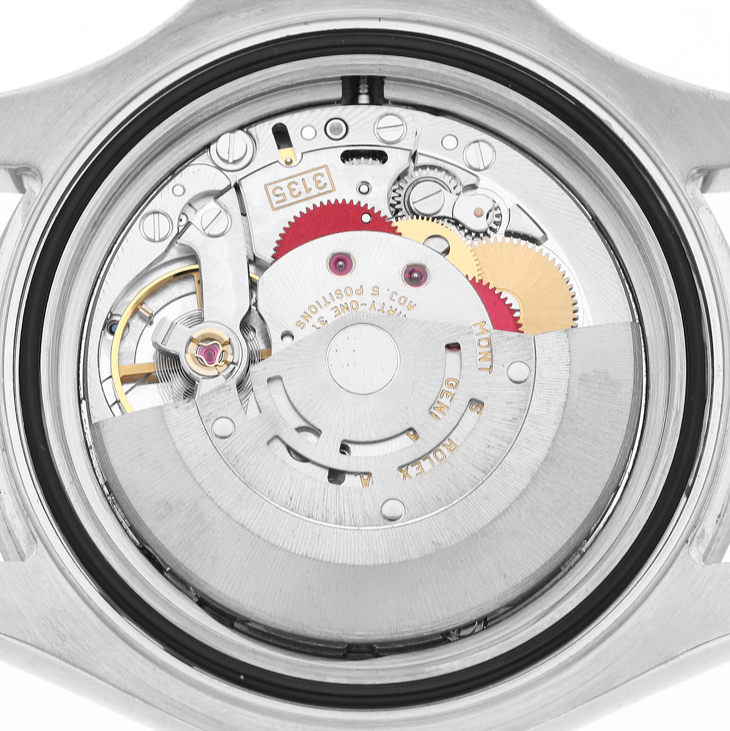 The image shows the movement mechanism from the back of a Rolex Yacht-Master 16622 Men's Stainless Steel Silver Dial watch, highlighting gears and the rotor.