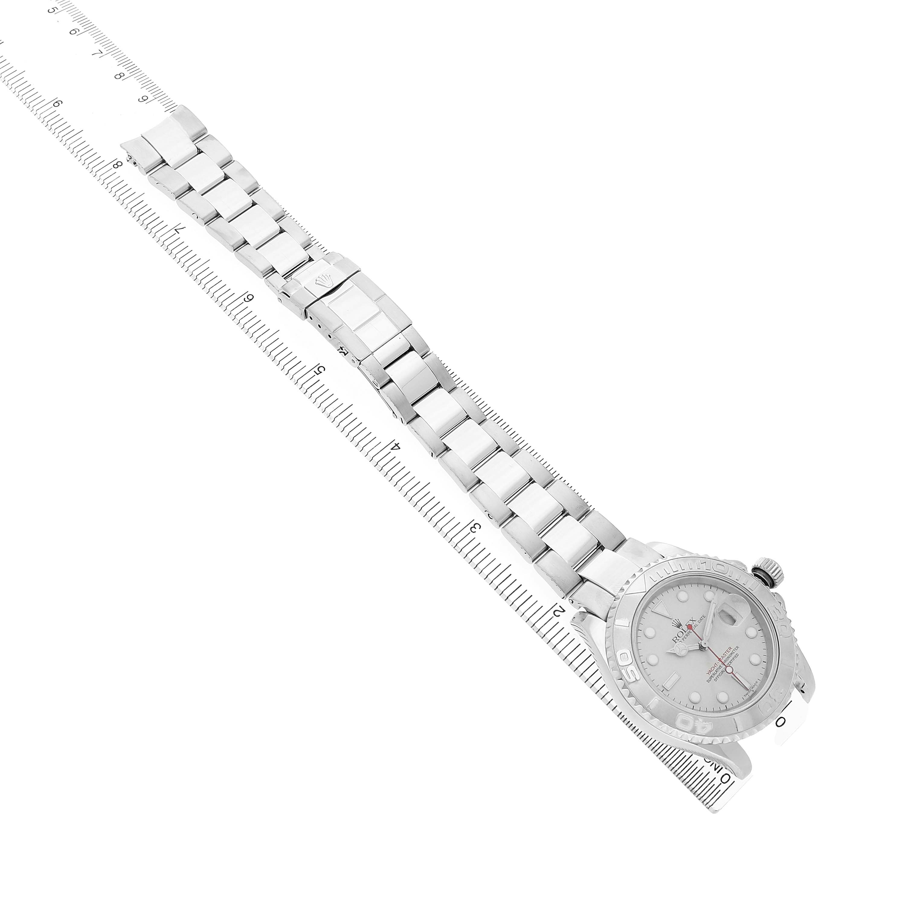 The Rolex Yacht-Master 16622 Men's Stainless Steel Silver Dial watch is shown from a top view, displaying both the face and full bracelet against a ruler for scale.
