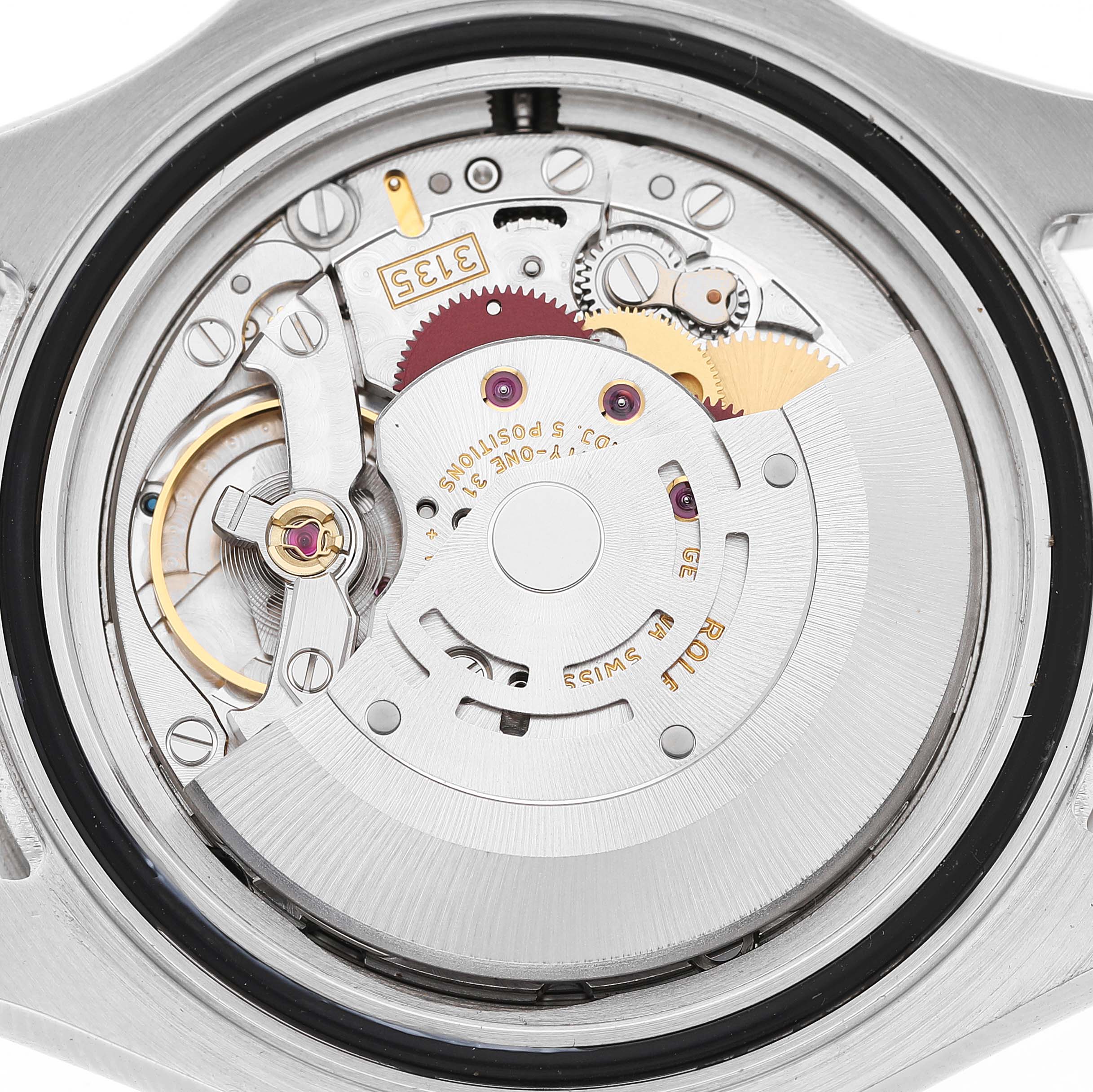 The image shows the movement of a Rolex Yacht-Master 16622 Men's Stainless Steel Silver Dial watch from the back, highlighting gears and mechanical components.