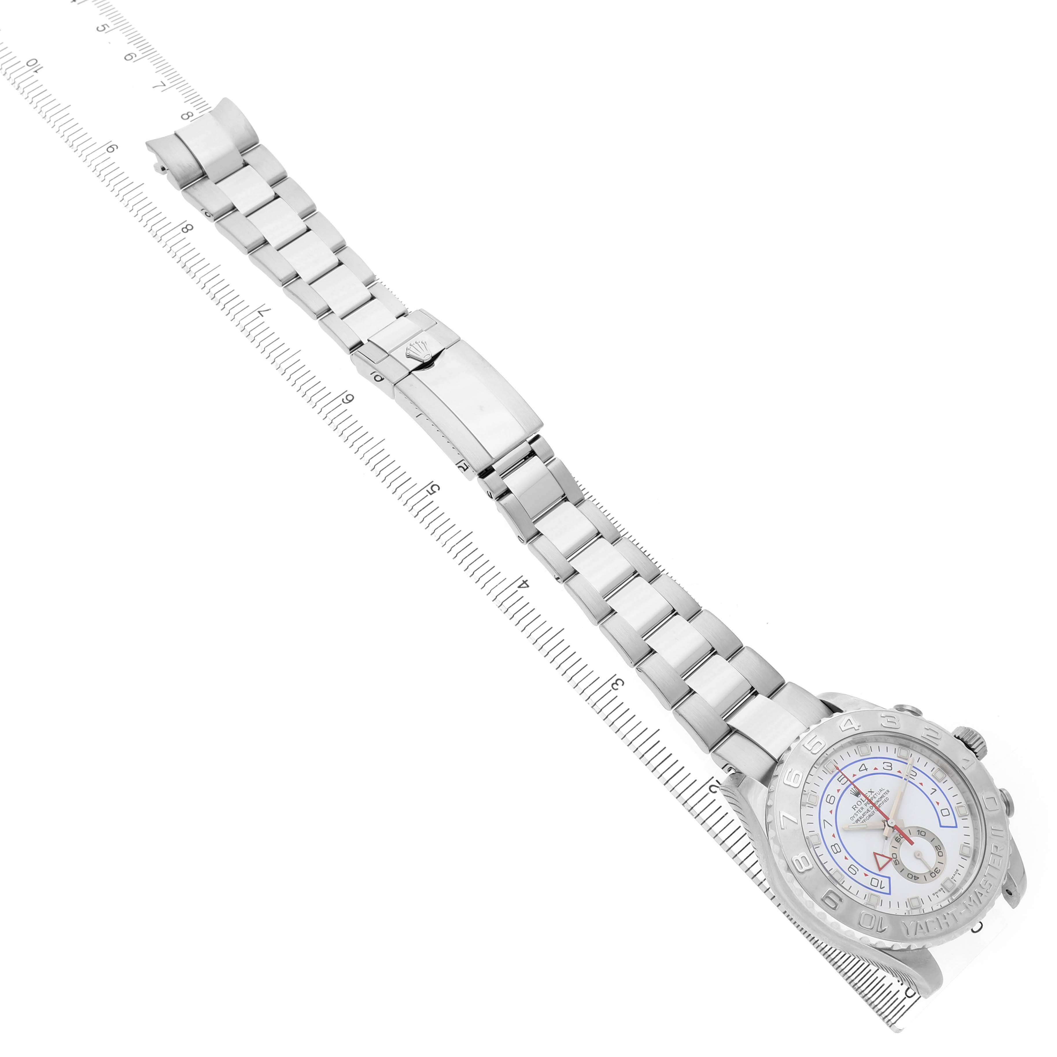 The Rolex Yacht-Master 116689 Men's White Gold White Dial watch is shown at an overhead angle, highlighting the bracelet, clasp, and face.