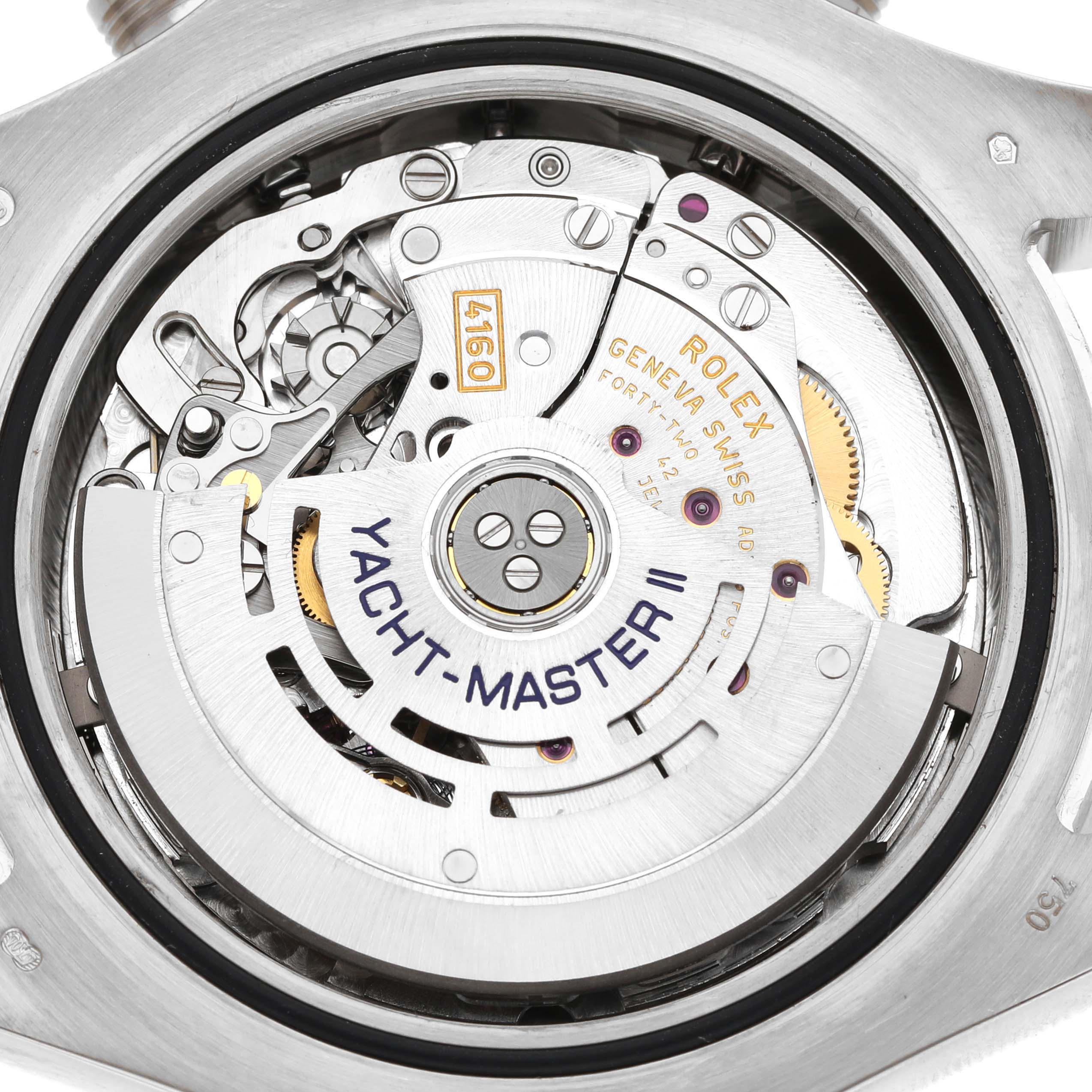 The image shows the movement of a Rolex Yacht-Master 116689 Men's White Gold White Dial II watch, viewed from the back, highlighting the intricate mechanical parts.