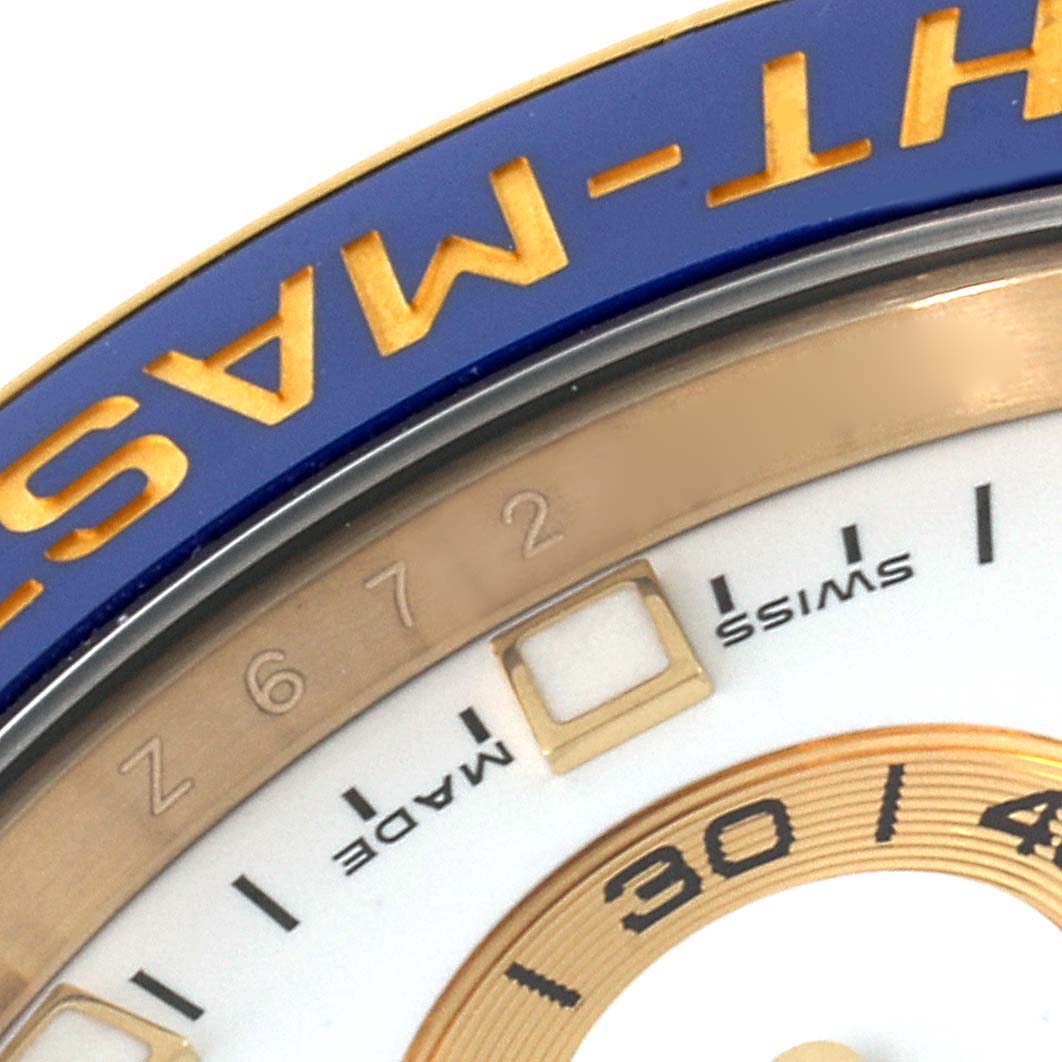 This image shows a close-up of the bezel and part of the dial of a Rolex Yacht-Master 116688 Men's Yellow Gold White Dial 116688 Men's Yellow Gold White Dial watch, highlighting the text and markers.