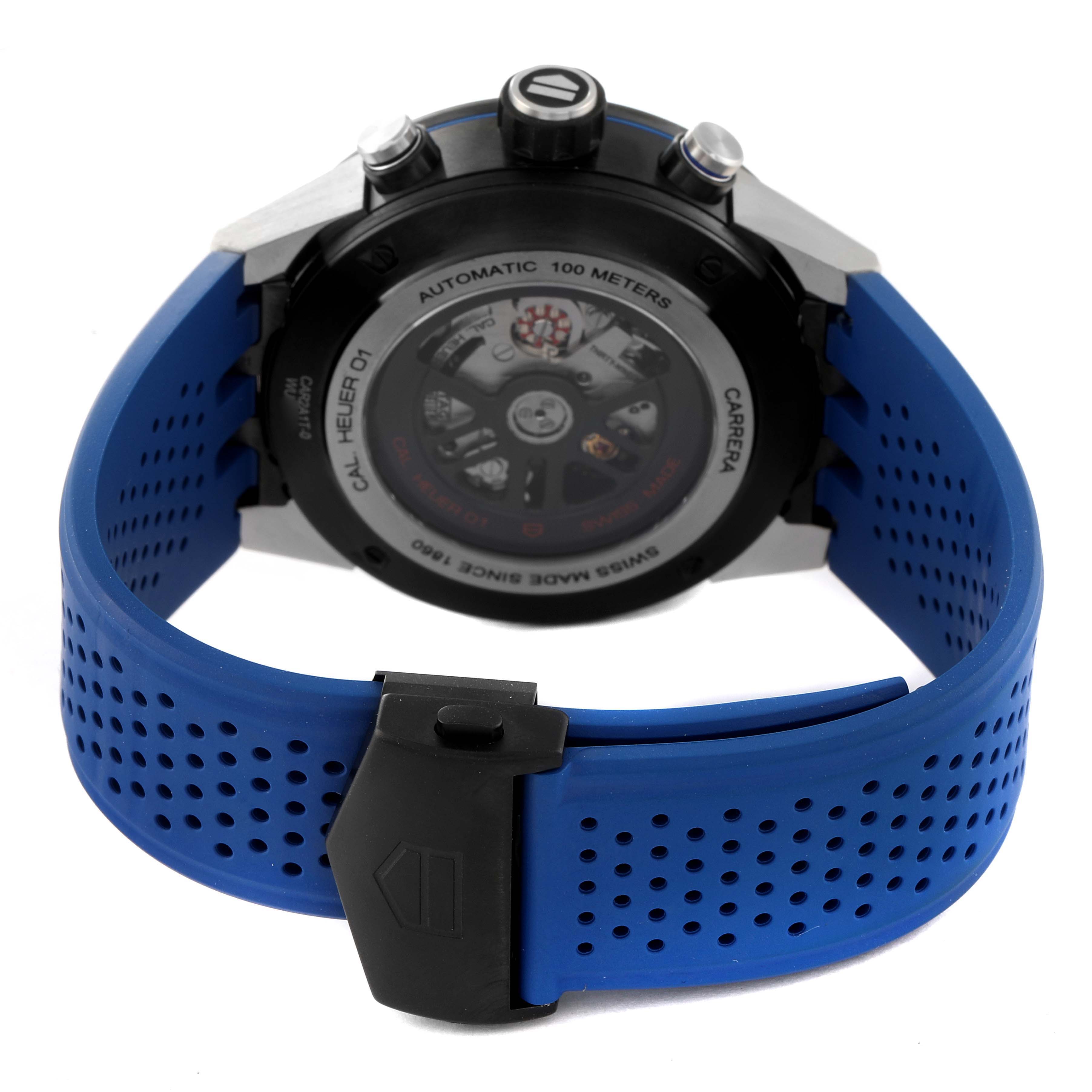 The image shows the back view of a Tag Heuer Carrera CAR2A1T Men
s Stainless Steel Black Dial CAR2A1T Men
s Stainless Steel Black Dial watch, displaying the movement and blue perforated rubber strap.