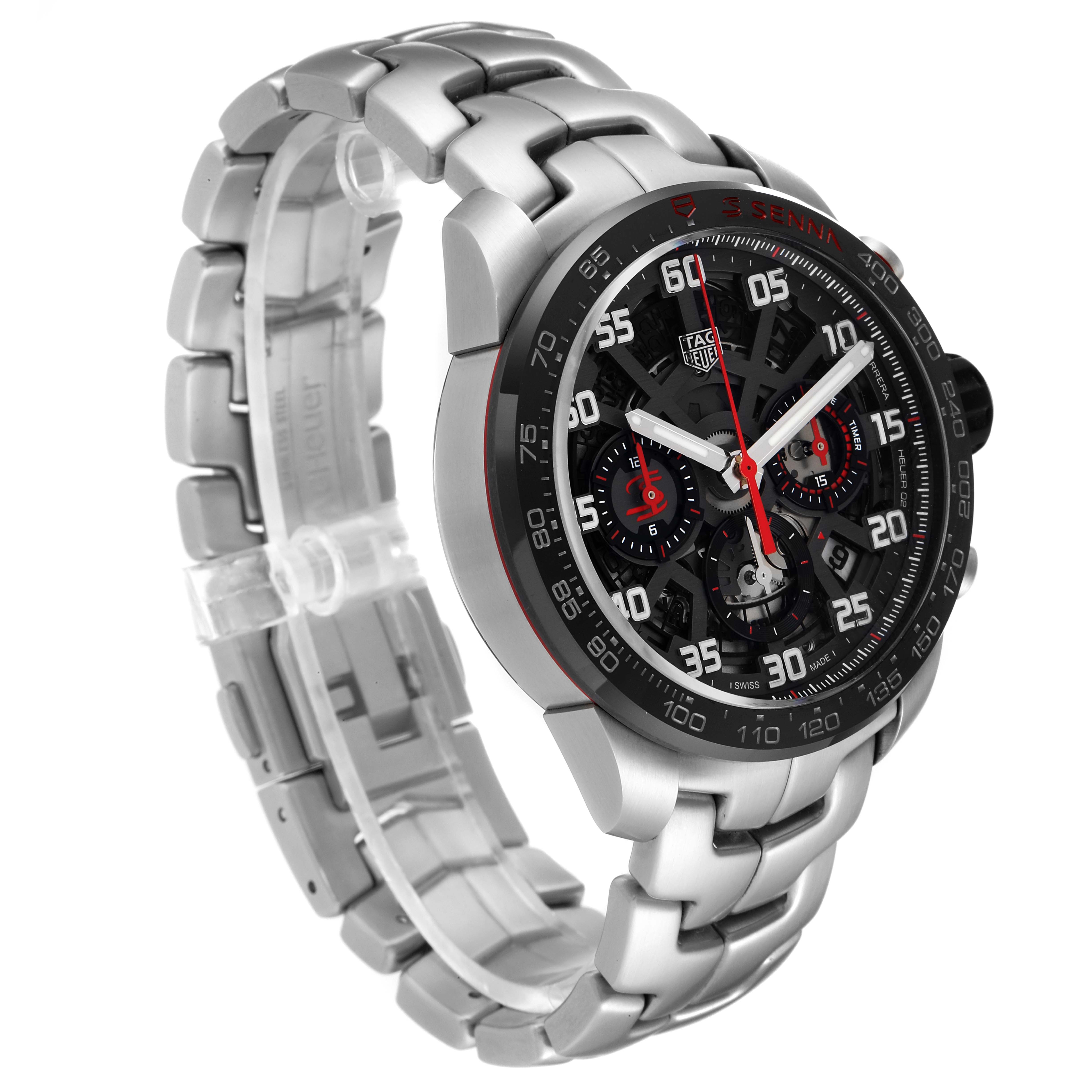 The image shows a Carrera model by Tag Heuer at an angle highlighting the face, bezel, and bracelet.