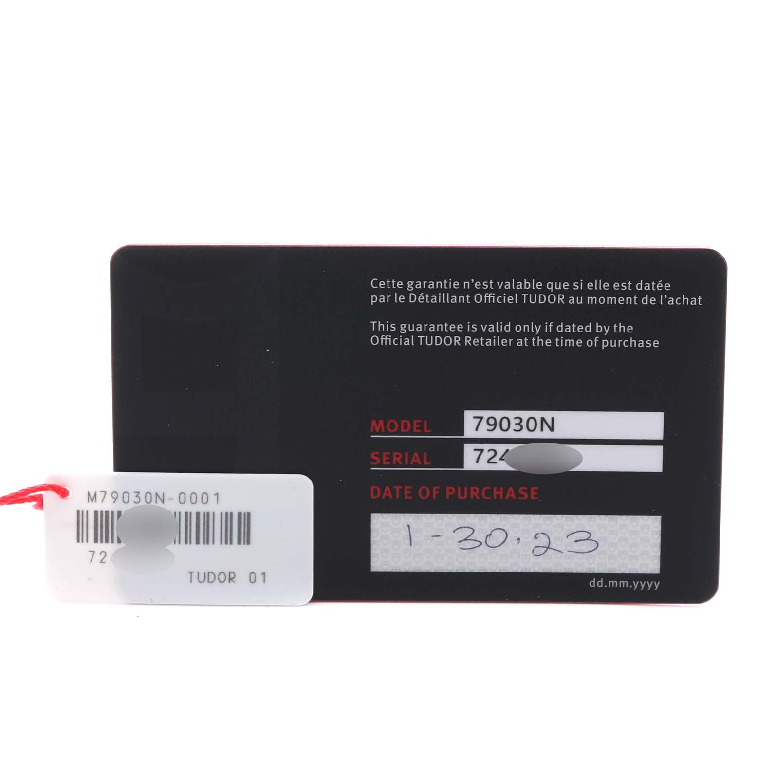 The image shows a warranty card for a Tudor Heritage Black Bay 79030N Men's Stainless Steel Black Dial 79030N Men's Stainless Steel Black Dial watch, displaying model and serial numbers, and the purchase date.