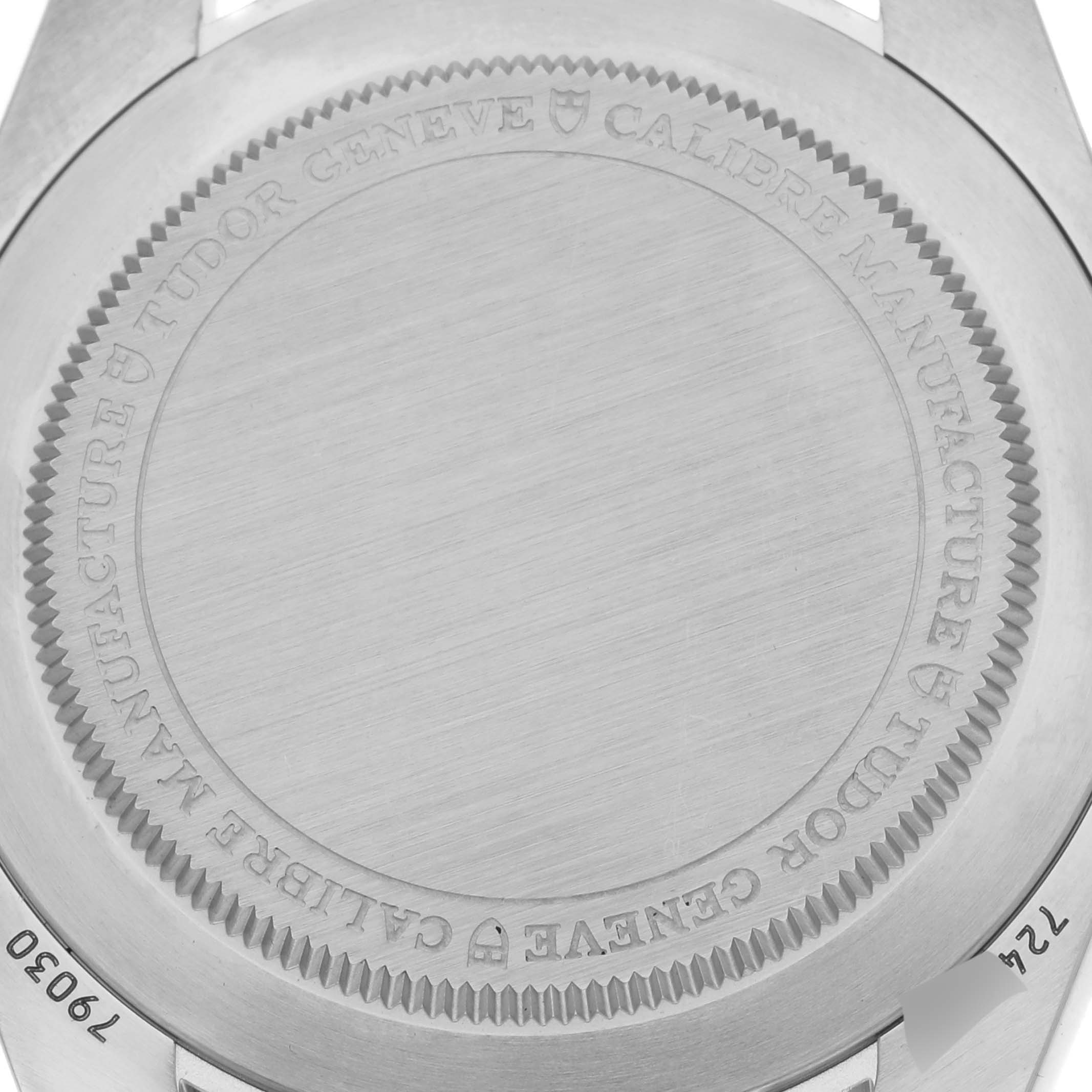 The image shows the back case of a Tudor Heritage Black Bay 79030N Men's Stainless Steel Black Dial 79030N Men's Stainless Steel Black Dial watch, highlighting its engravings.