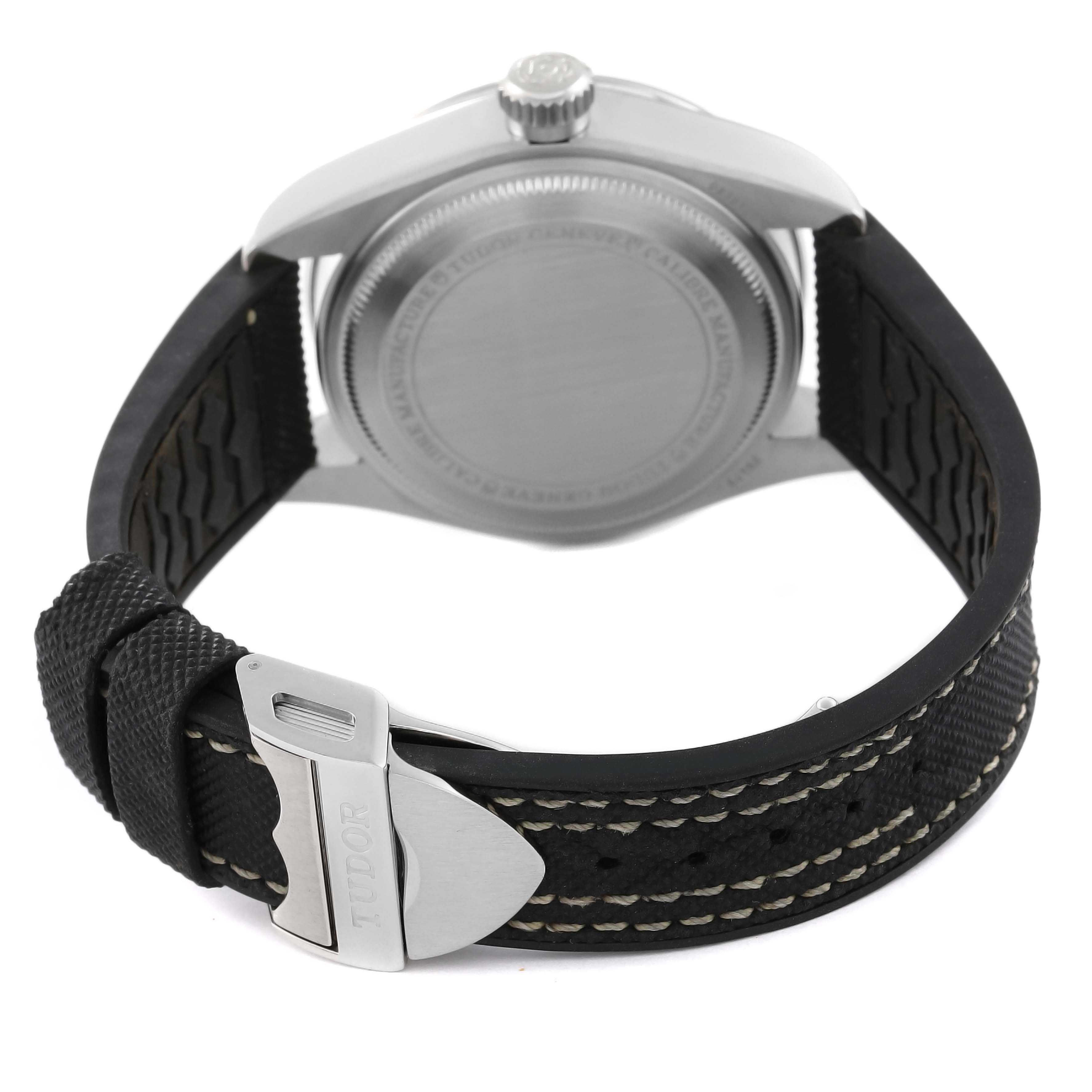 This image shows the backside and the strap of the Tudor Heritage Black Bay M79470-0003 Men
s Stainless Steel Black Dial M79470-0003 Men
s Stainless Steel Black Dial watch, featuring a metal buckle with the brand name.