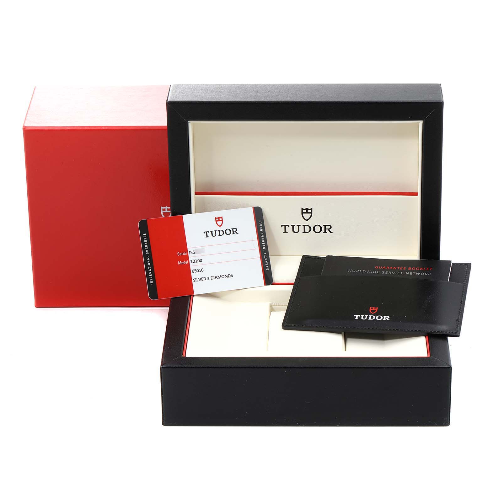 The image shows the packaging, guarantee booklet, and warranty card for the Tudor Style M12100-0003 Women's Stainless Steel Silver Dial M12100-0003 Women's Stainless Steel Silver Dial model watch.