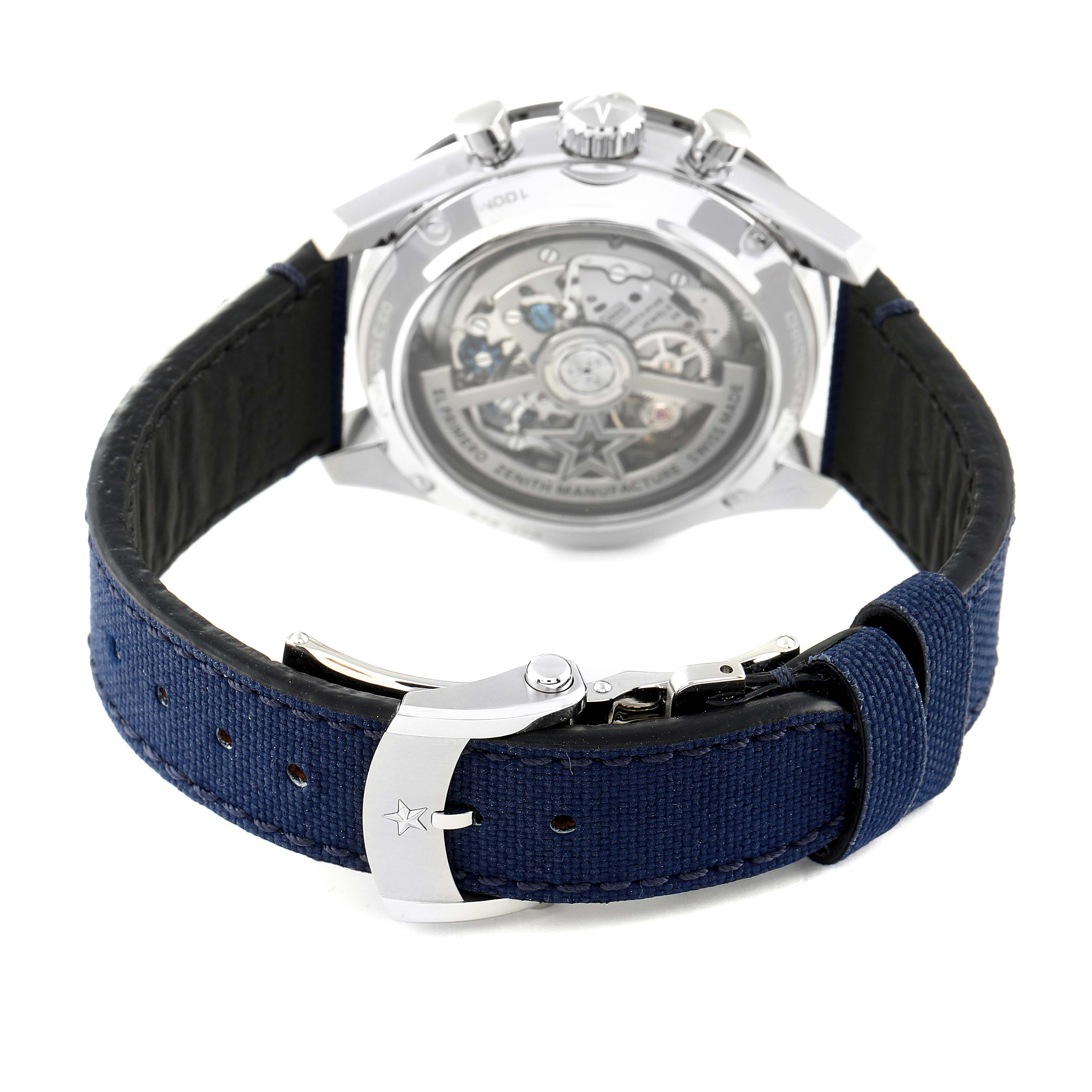 The image shows the back view of the Zenith Chronomaster 03.3100.3600 Men
s Stainless Steel White Dial 03.3100.3600 Men
s Stainless Steel White Dial watch, highlighting the movement and the clasp on the blue strap.