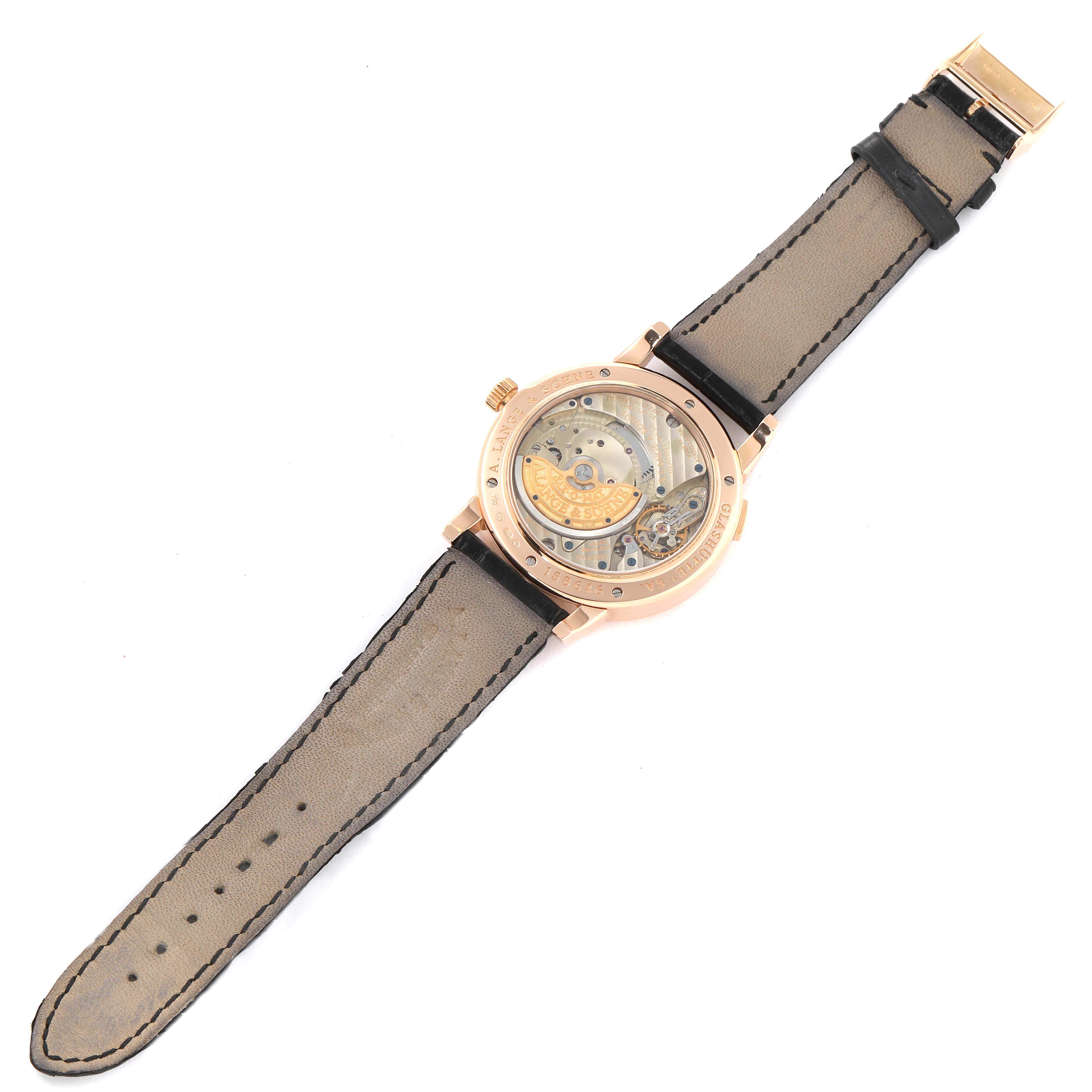 The image shows the back view of the A. Lange & Sohne Richard Lange 309.031 Men's Rose Gold Black Dial watch, displaying the movement and leather strap.