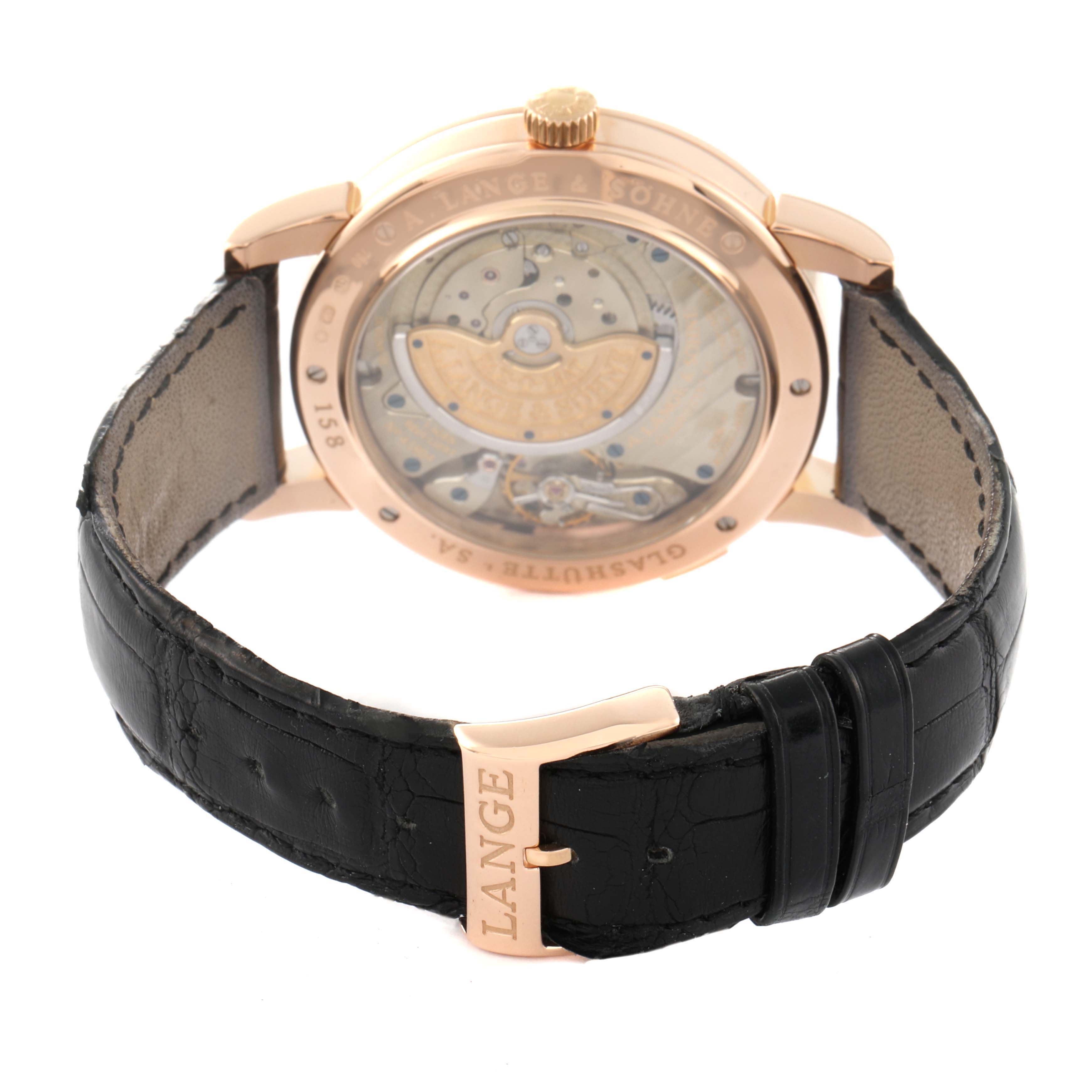 The image shows the back view of the Richard Lange model by A. Lange & Söhne, highlighting the movement and black leather strap.