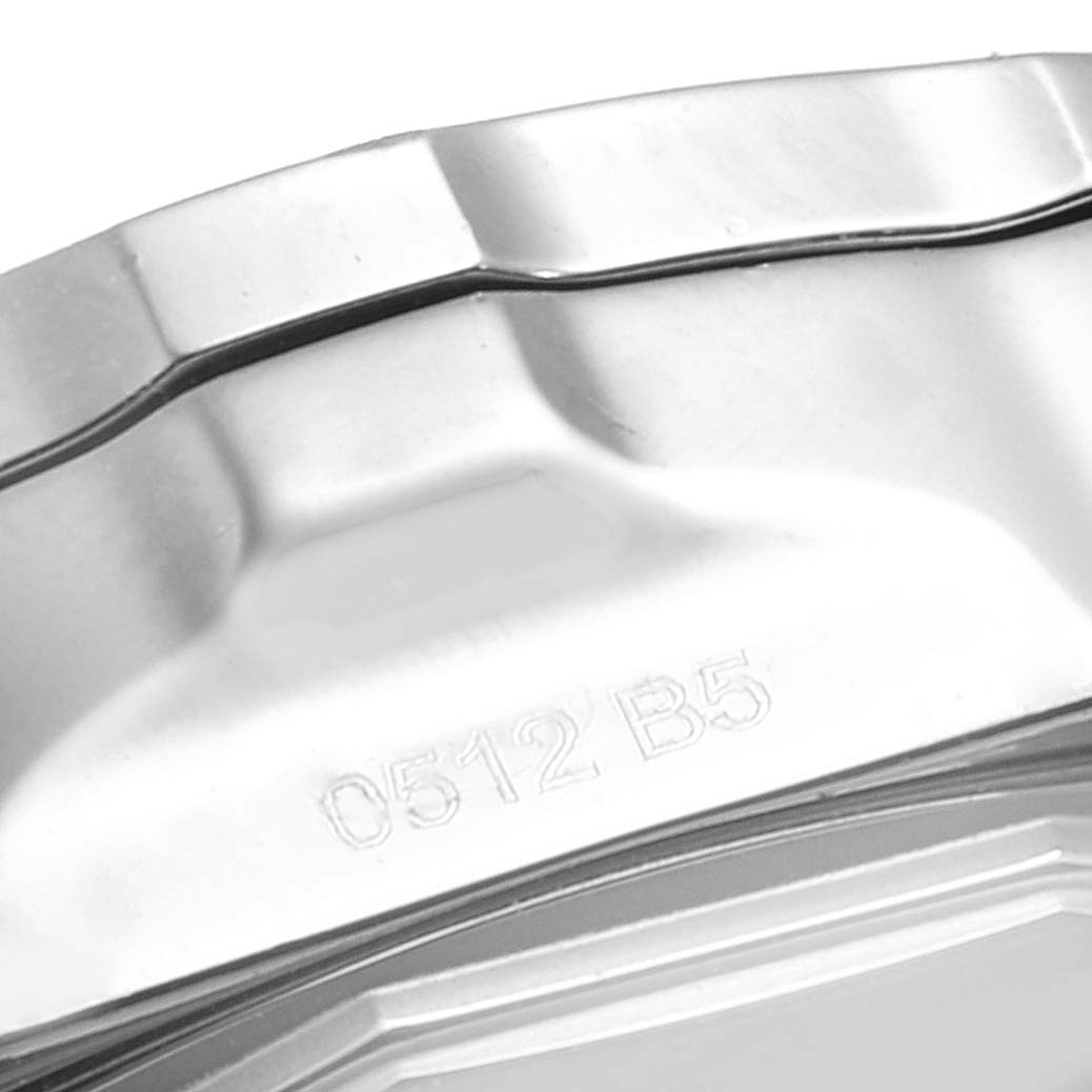 This image shows a close-up of the back case of a Breitling Colt A73387 Men
s Stainless Steel White Dial A73387 Men
s Stainless Steel White Dial watch, focusing on its beveled edge and engraved serial number.