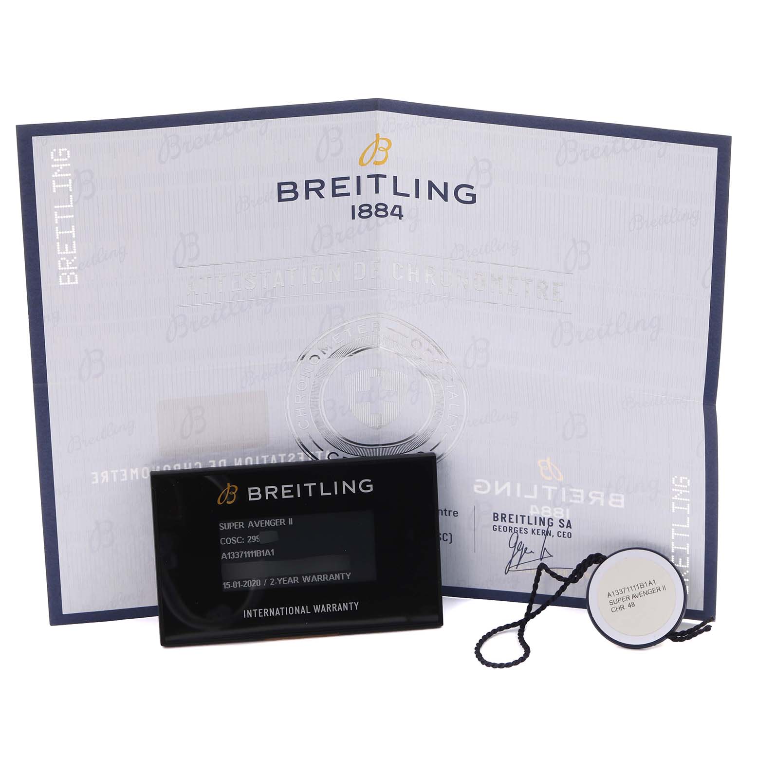 The image shows Breitling Avenger A13371111B1A1 Men's Stainless Steel Black Dial A13371111B1A1 Men's Stainless Steel Black Dial documentation and accessories, including a warranty card and tag, viewed from above.