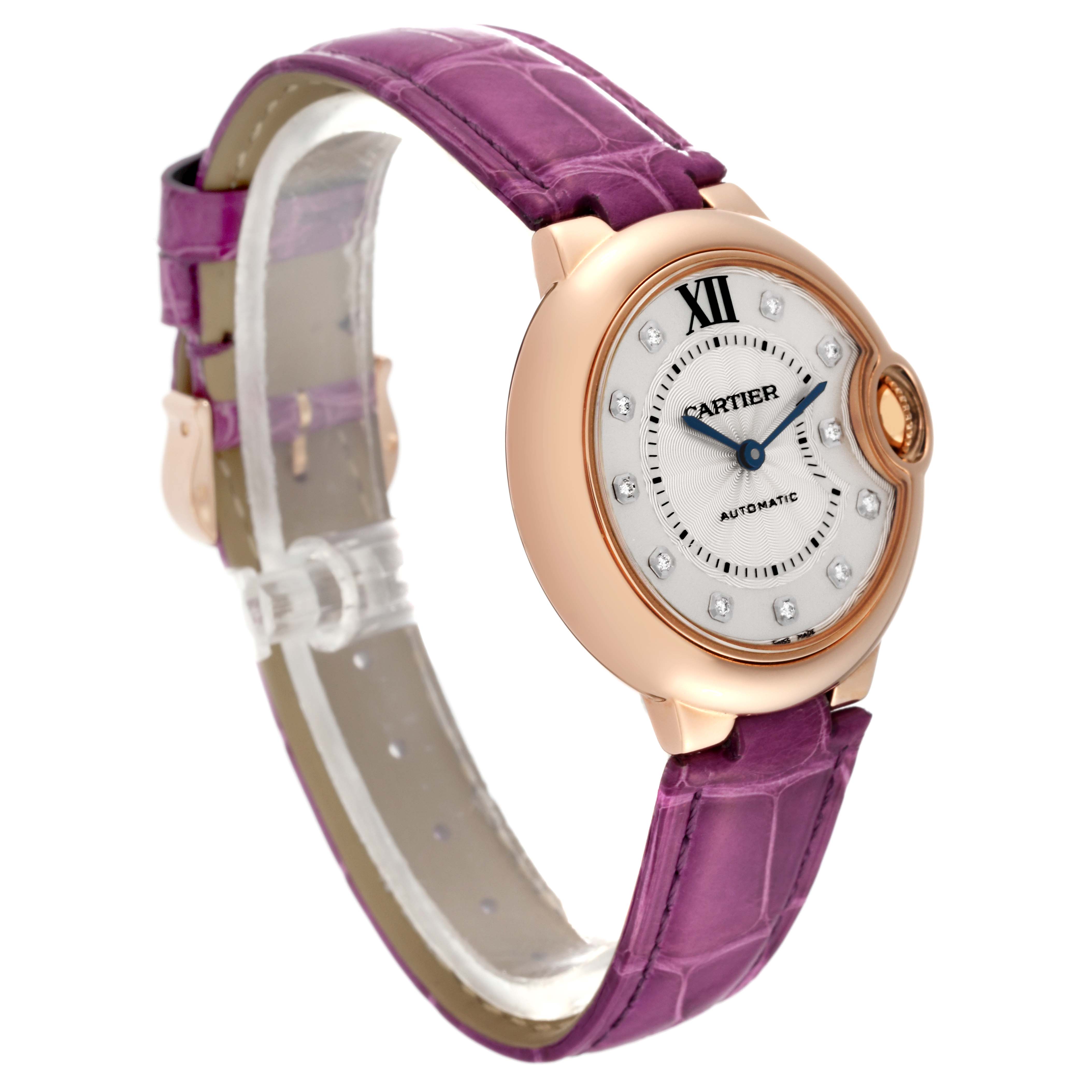The image shows a side angle of the Cartier Ballon Bleu WE902063 Women
s Rose Gold Silver Dial WE902063 Women
s Rose Gold Silver Dial watch, highlighting its purple strap, round dial, and rose gold case.