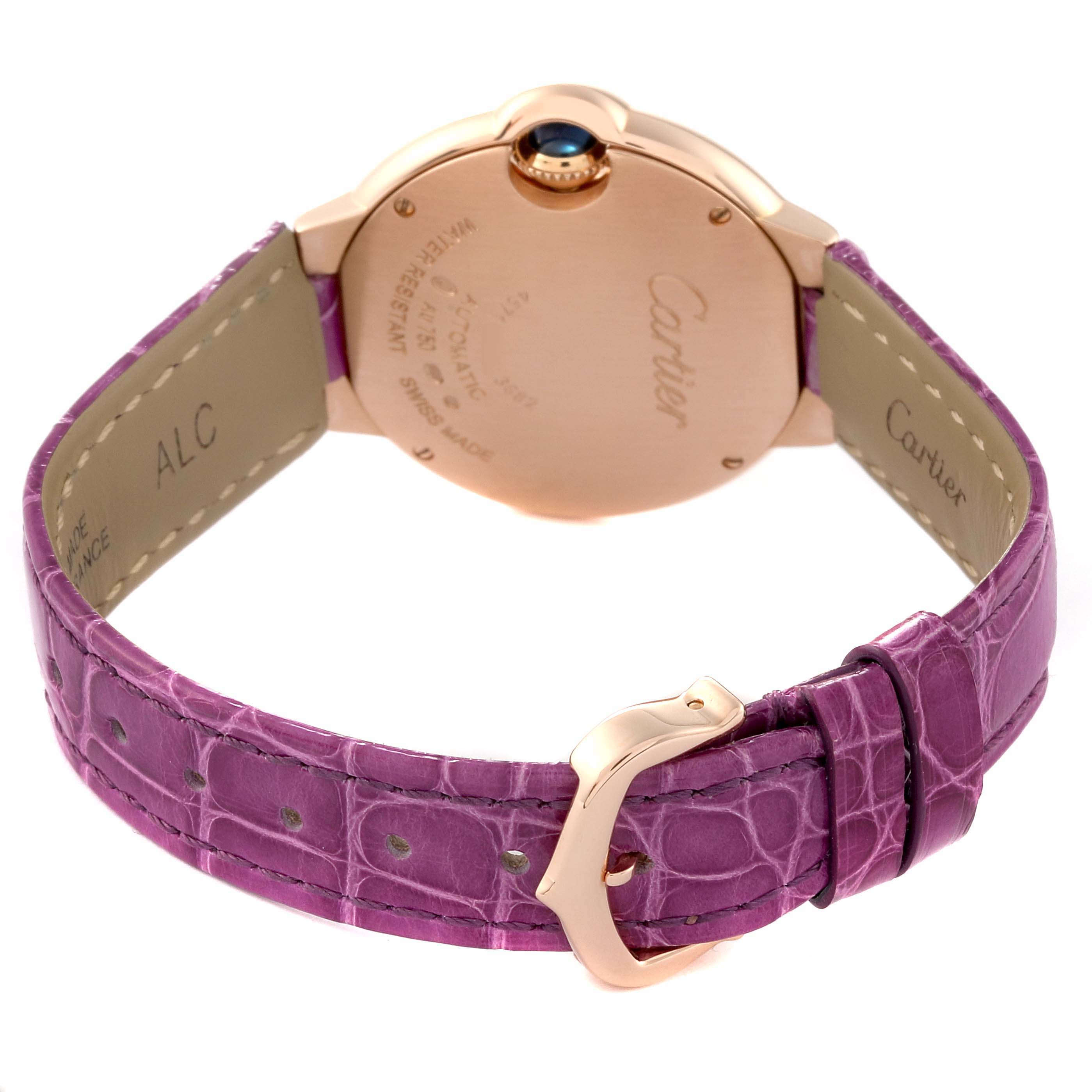 The image shows the back of a Ballon Bleu watch by Cartier, highlighting the case back, crown, and purple leather strap with buckle.