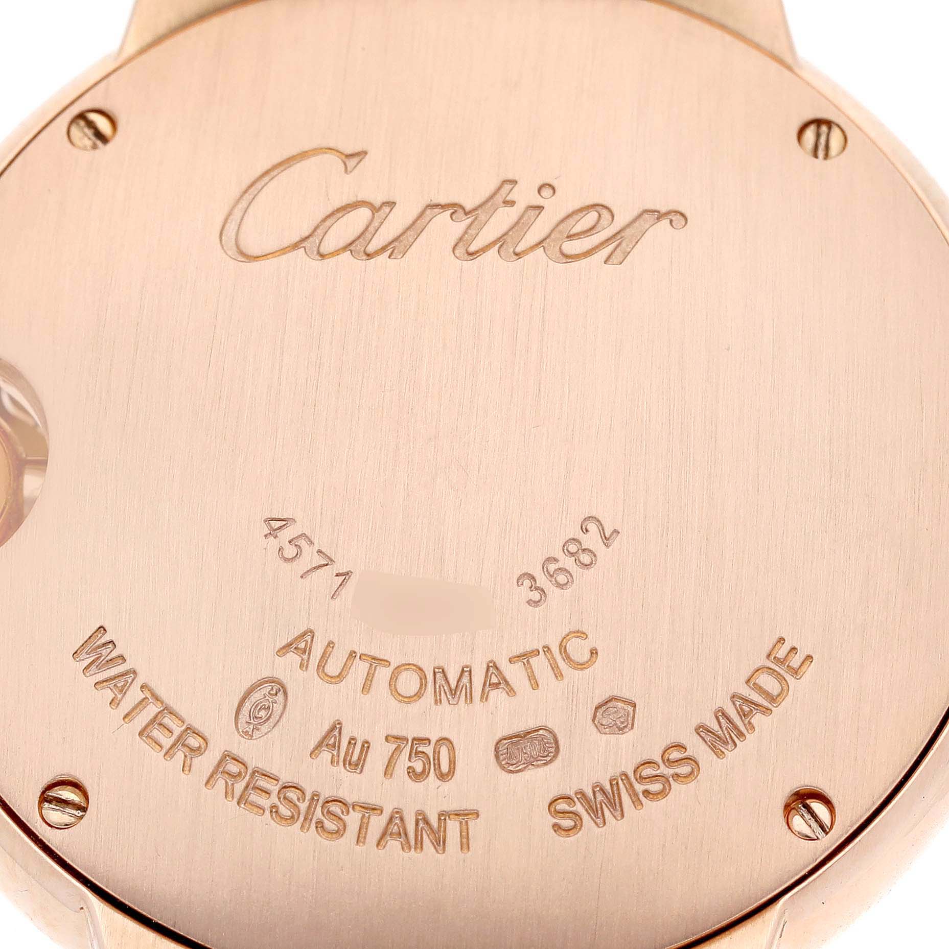 The image shows the back case of a Cartier Ballon Bleu WE902063 Women
s Rose Gold Silver Dial WE902063 Women
s Rose Gold Silver Dial watch, displaying its inscriptions and identification markings.